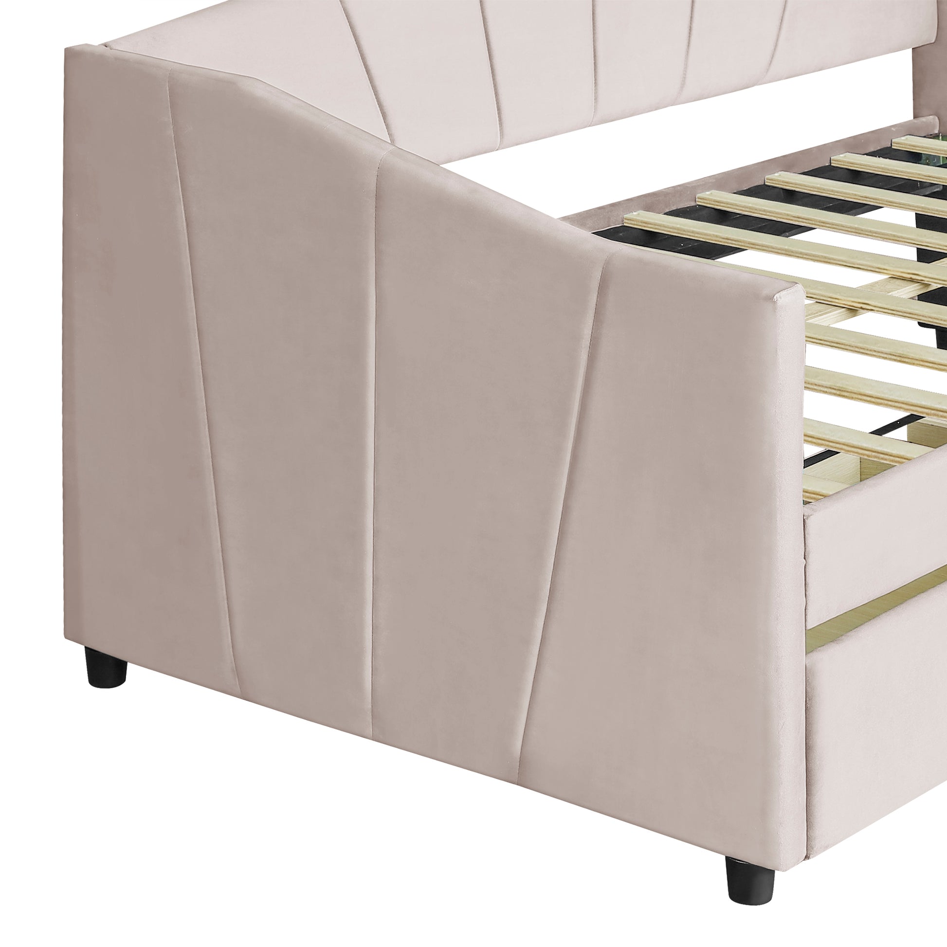 Cream velvet daybed with channel tufting and visible wooden slats