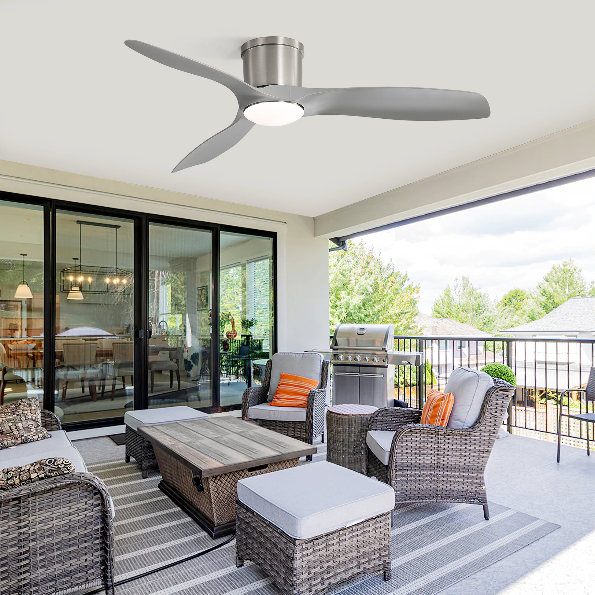 Modern brushed nickel ceiling fan with integrated LED light ideal for covered patios