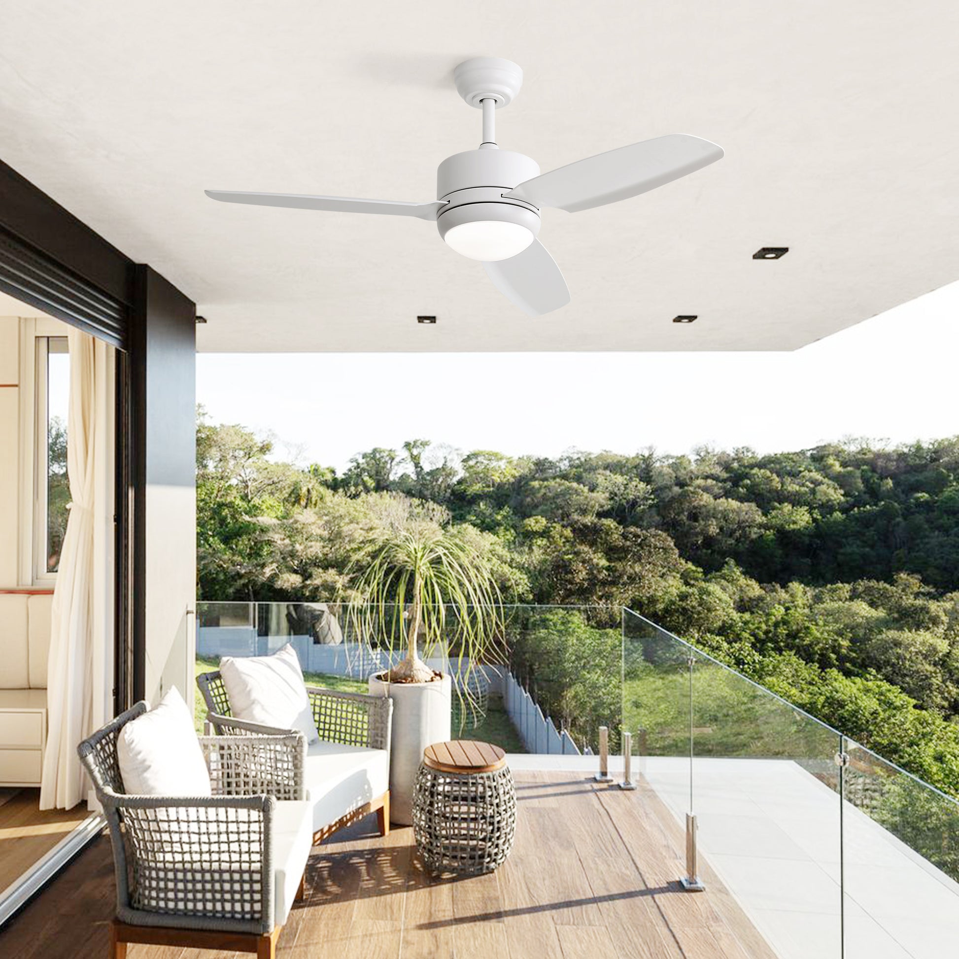 Modern white ceiling fan with LED light on a covered patio