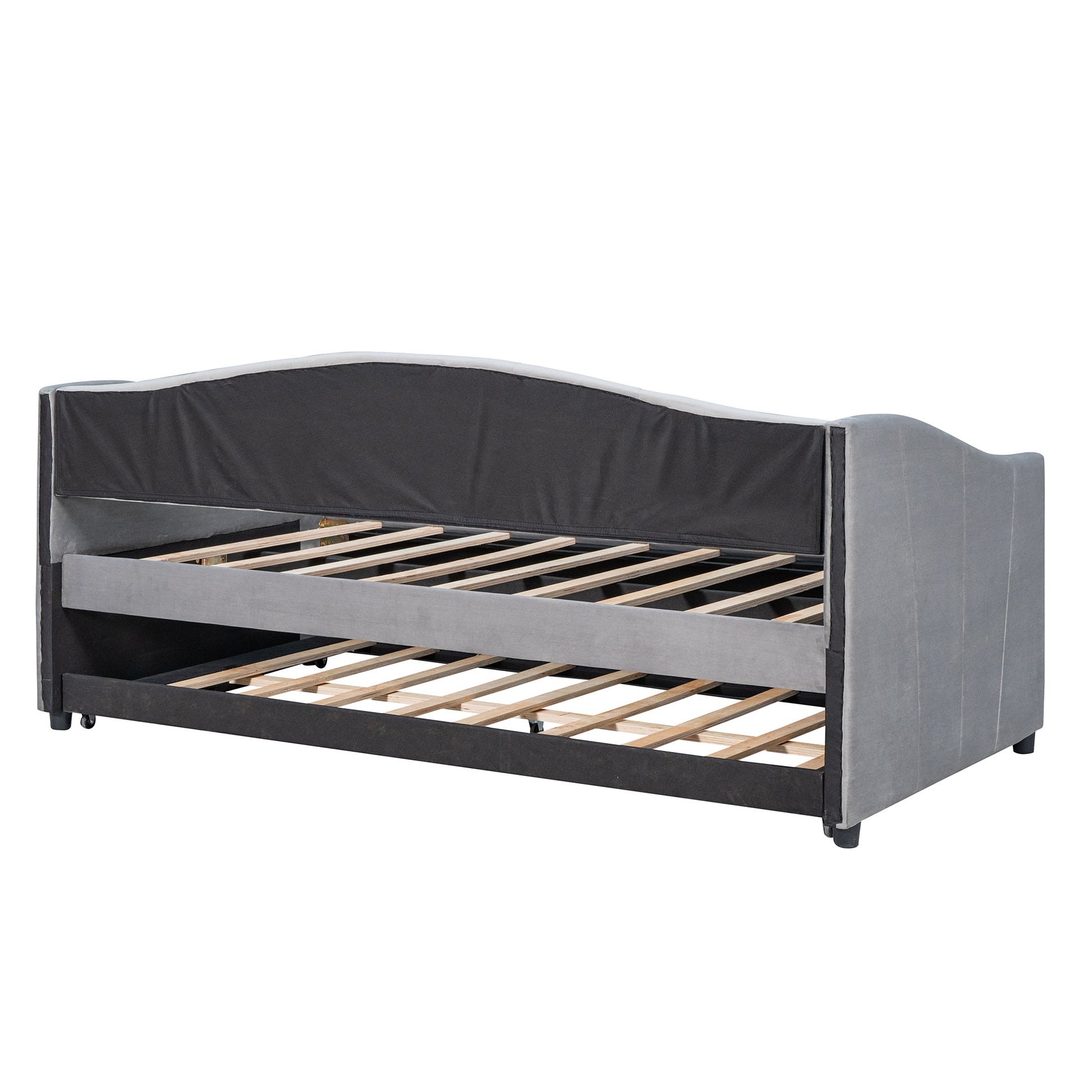 Gray upholstered daybed with a pullout trundle frame