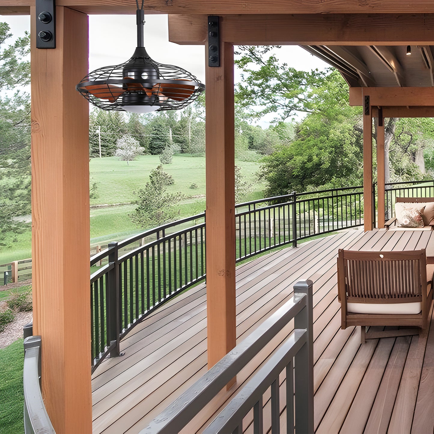 Black caged outdoor fan with wood blades on a covered porch
