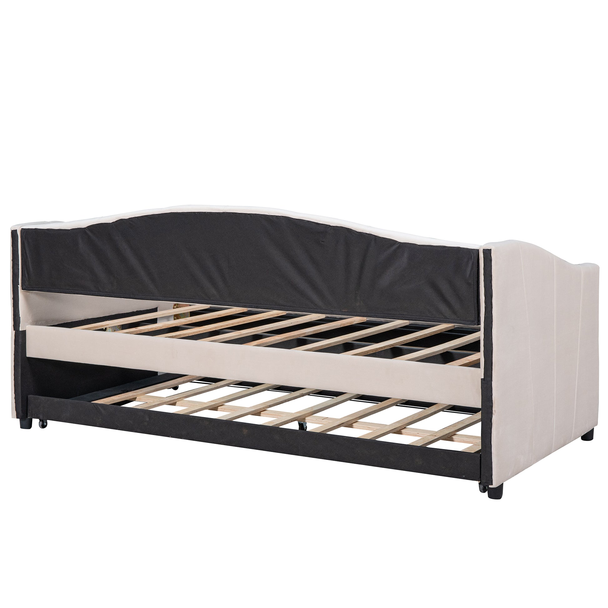Cream upholstered daybed with pullout trundle and slatted base