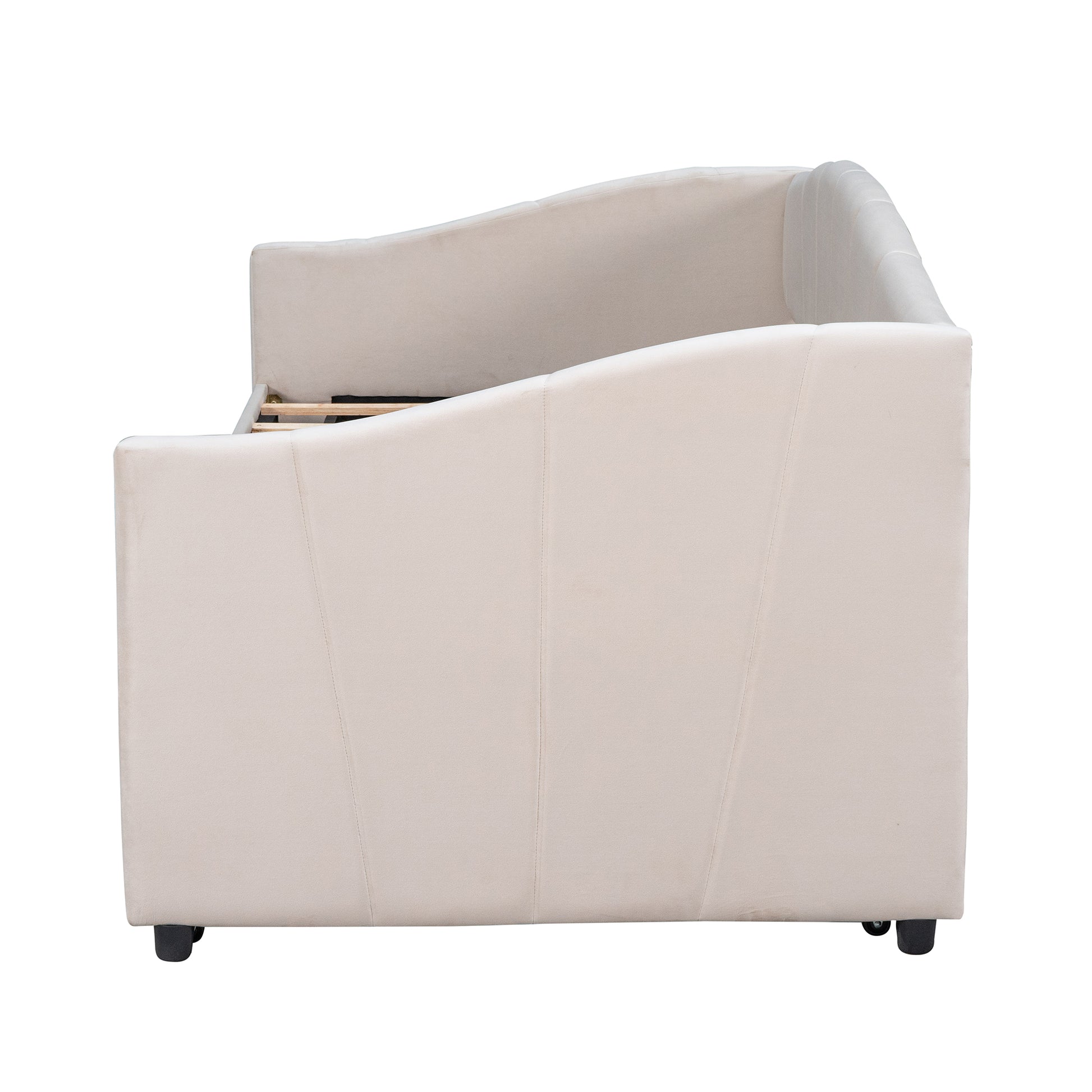 Cream velvet daybed with tufted back and wooden slats visible