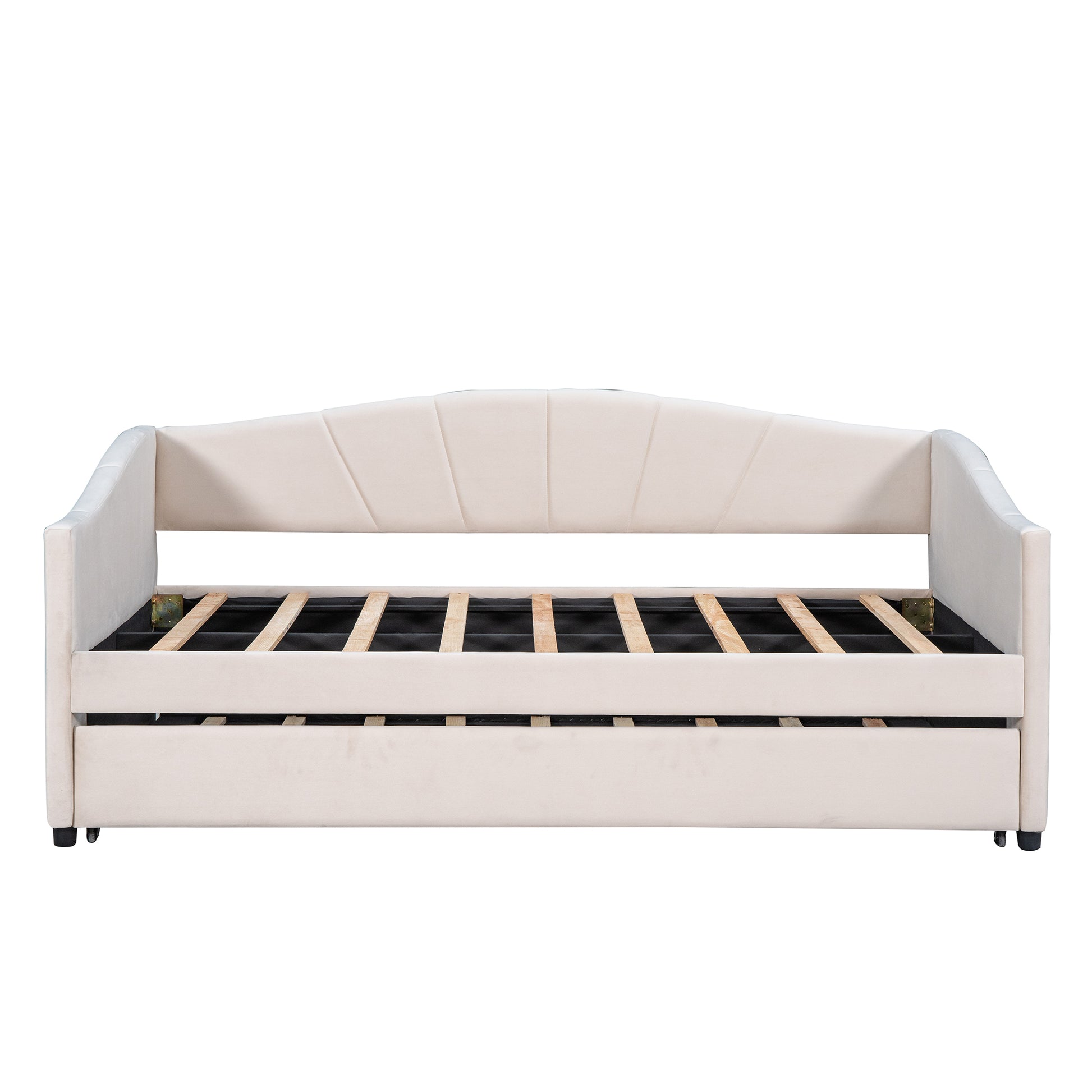 Cream velvet upholstered daybed with scalloped back and pullout trundle