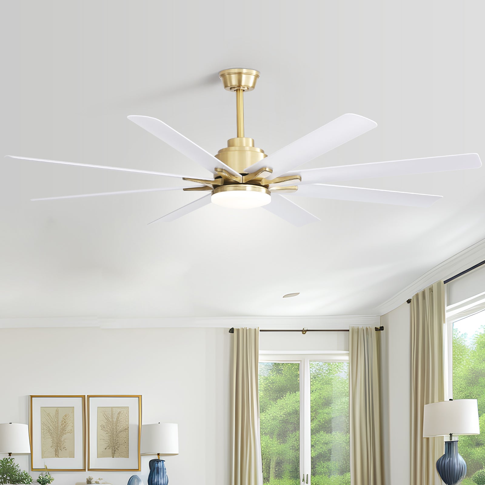 Modern blade ceiling fan in brushed brass with white blades and integrated LED light