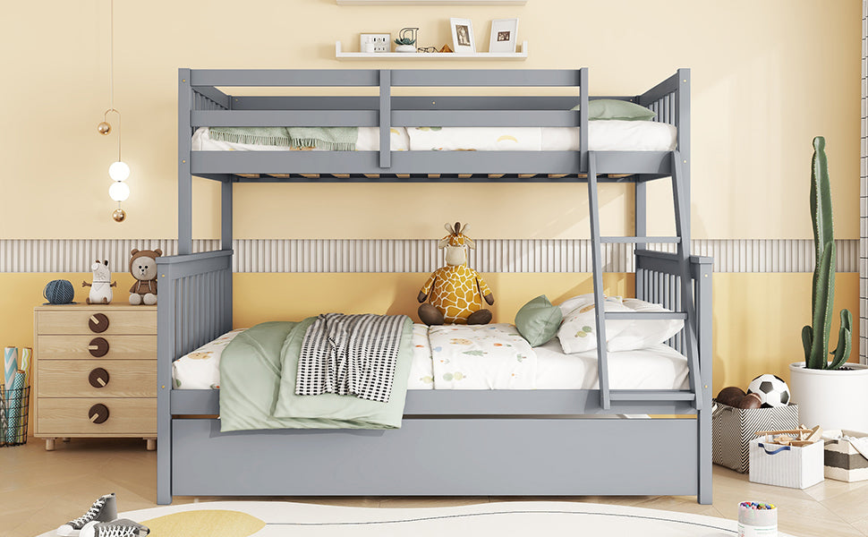 Gray wooden triple bunk bed with white bedding and playful toys