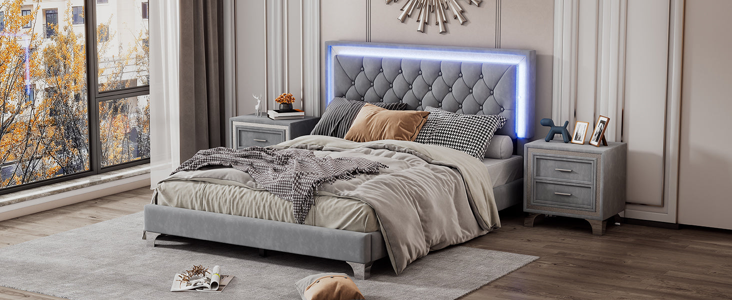 Luxurious grey upholstered king bed with tufted headboard and LED lighting