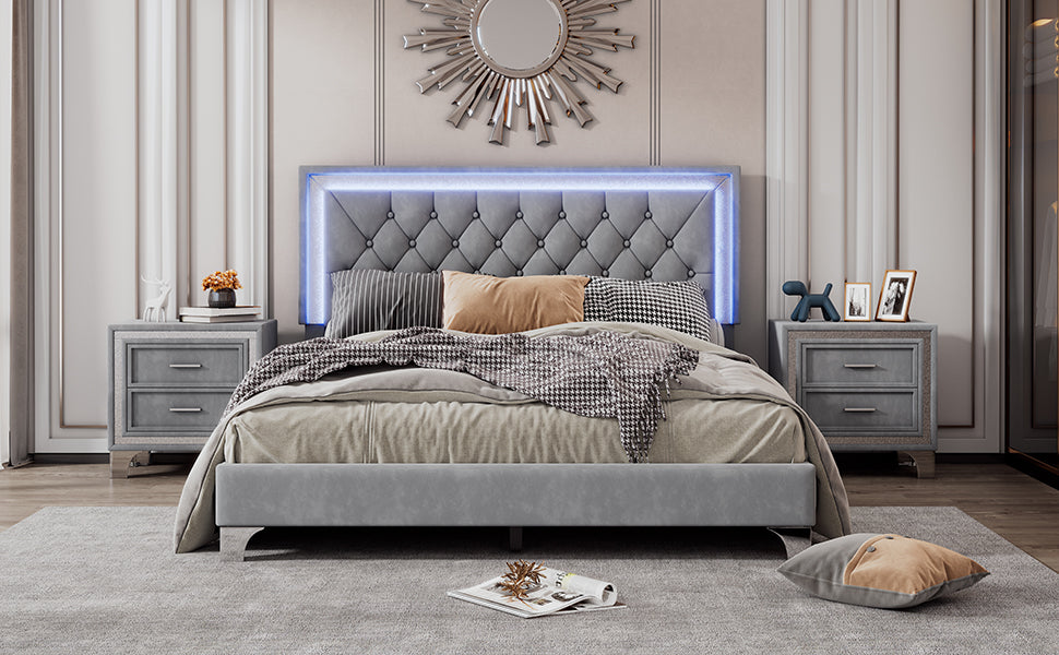 Tufted grey velvet bed frame with integrated blue LED lighting and button tufting