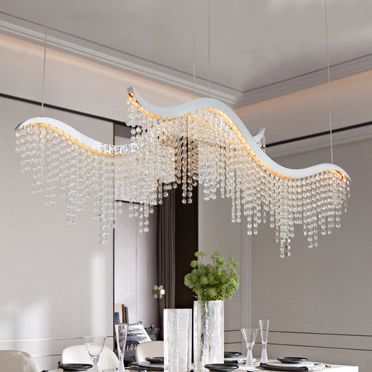 Modern waveshaped dining chandelier with cascading crystal pendants and warm LED lighting