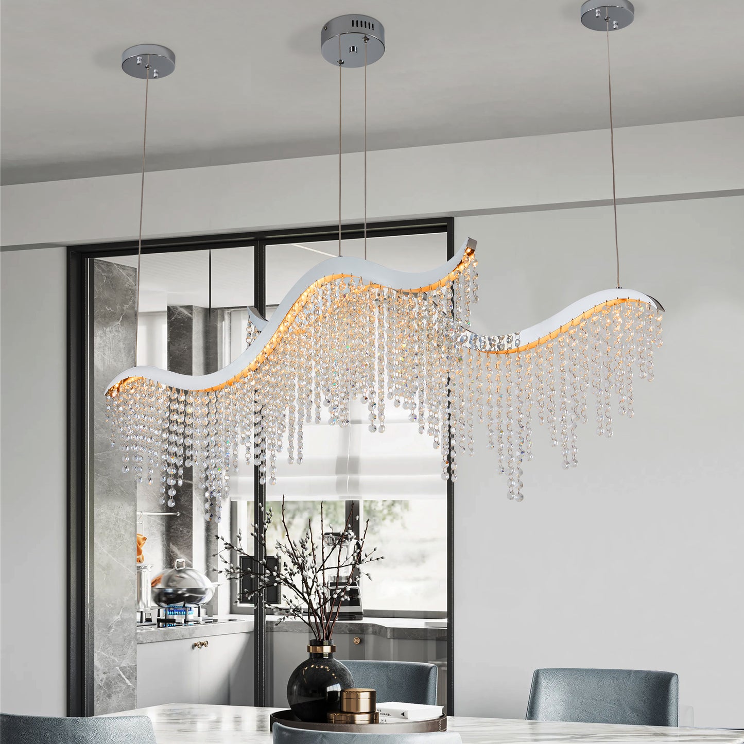 Modern waveshaped chrome chandelier with cascading crystal accents perfect for dining rooms