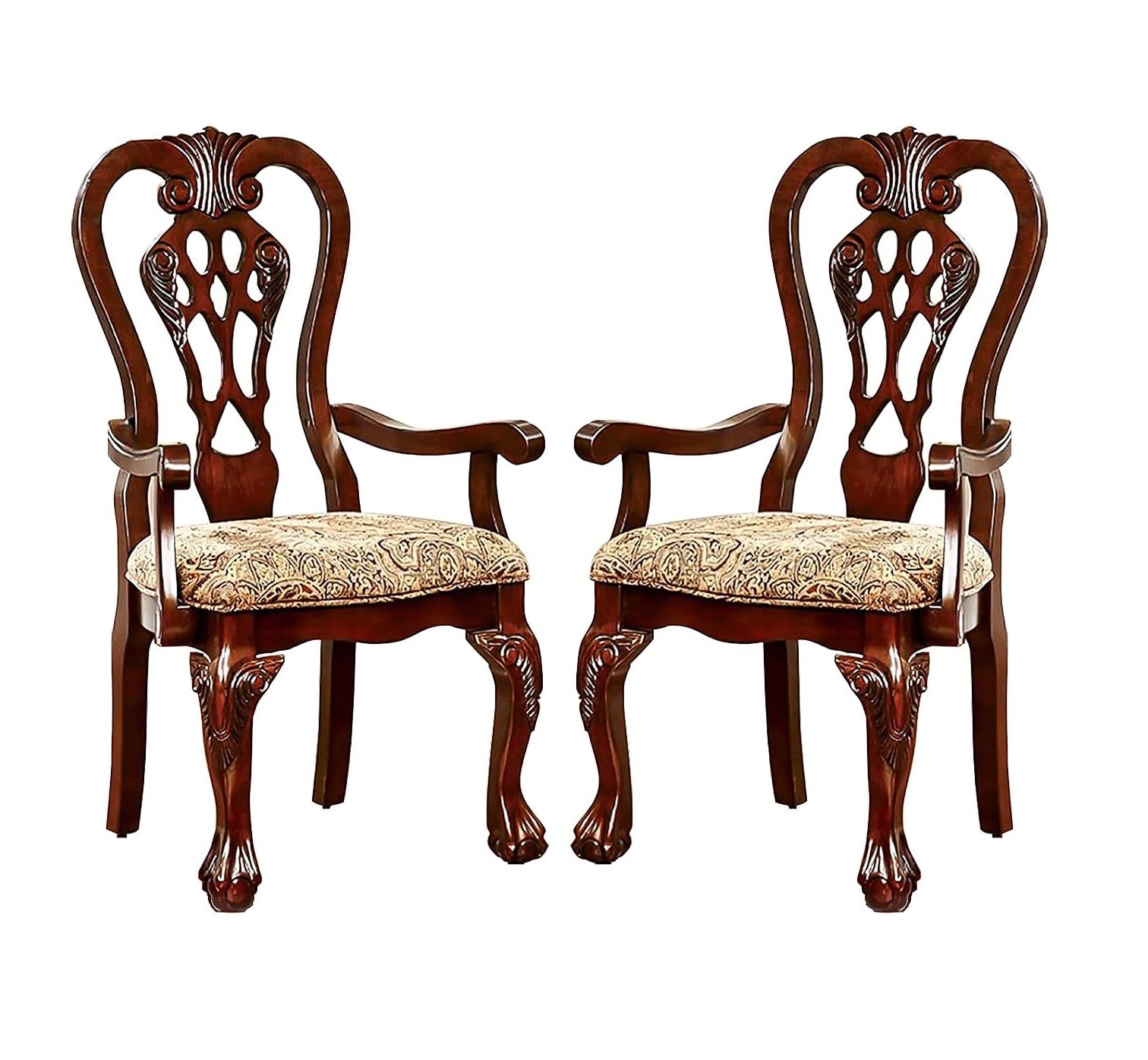 Two traditional dark wood armchairs with ornate carved backs and claw feet upholstered in patterned fabric