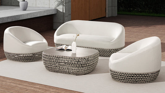 White upholstered sofa with woven base and oval coffee table