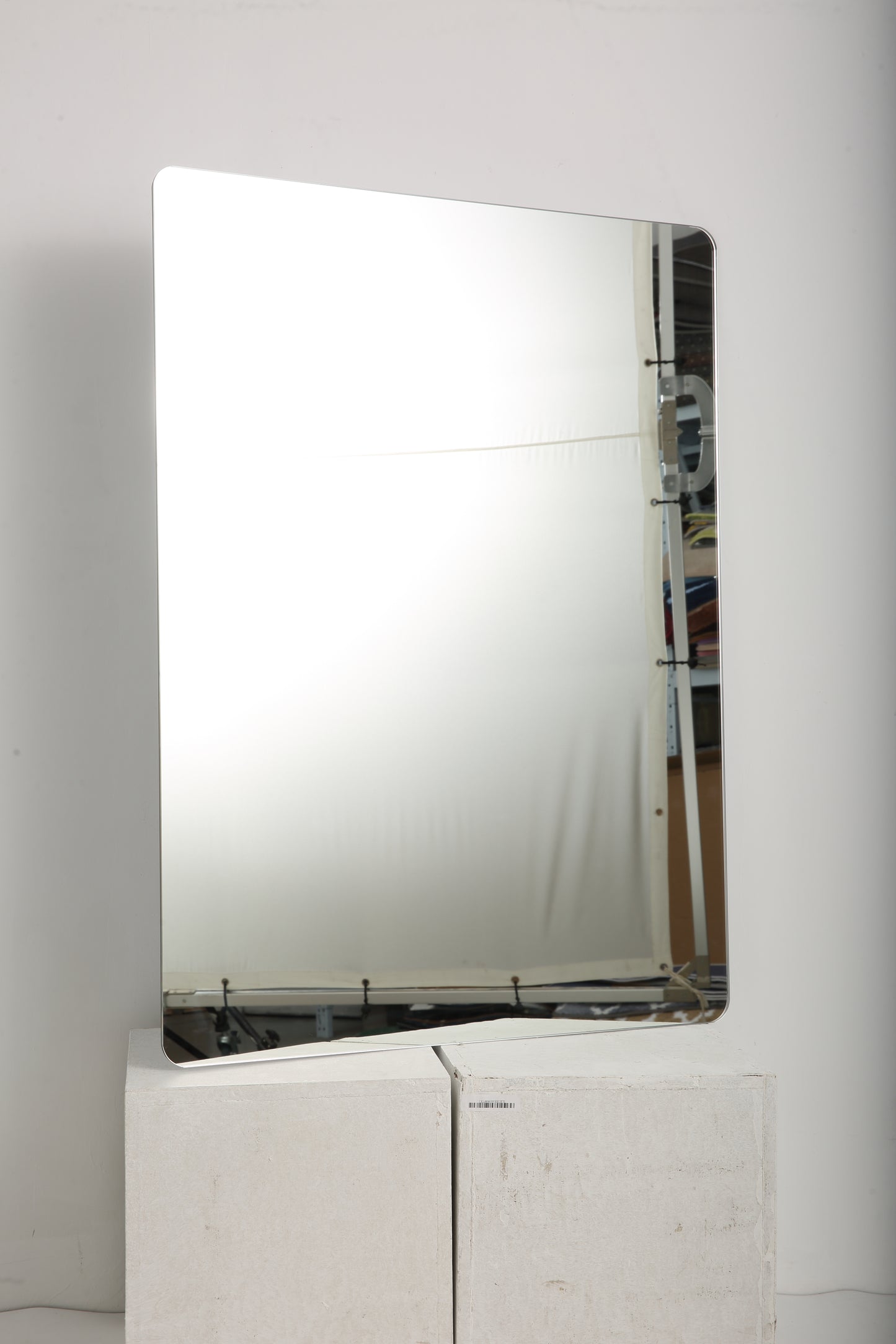 Modern rectangular wall mirror with rounded corners and a slim silver frame
