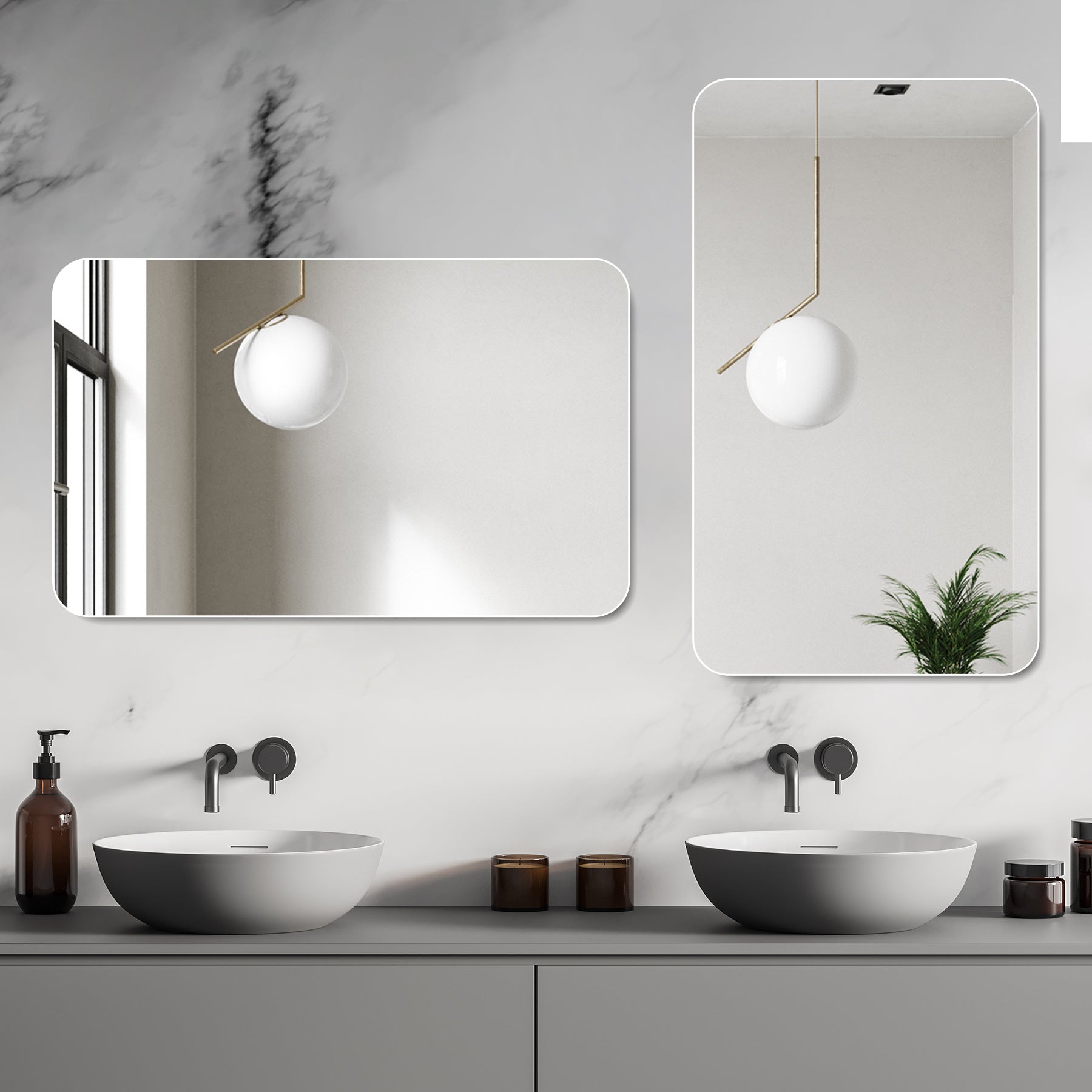 Rounded rectangular frameless bathroom mirror with brass accent and white orb pendant light above