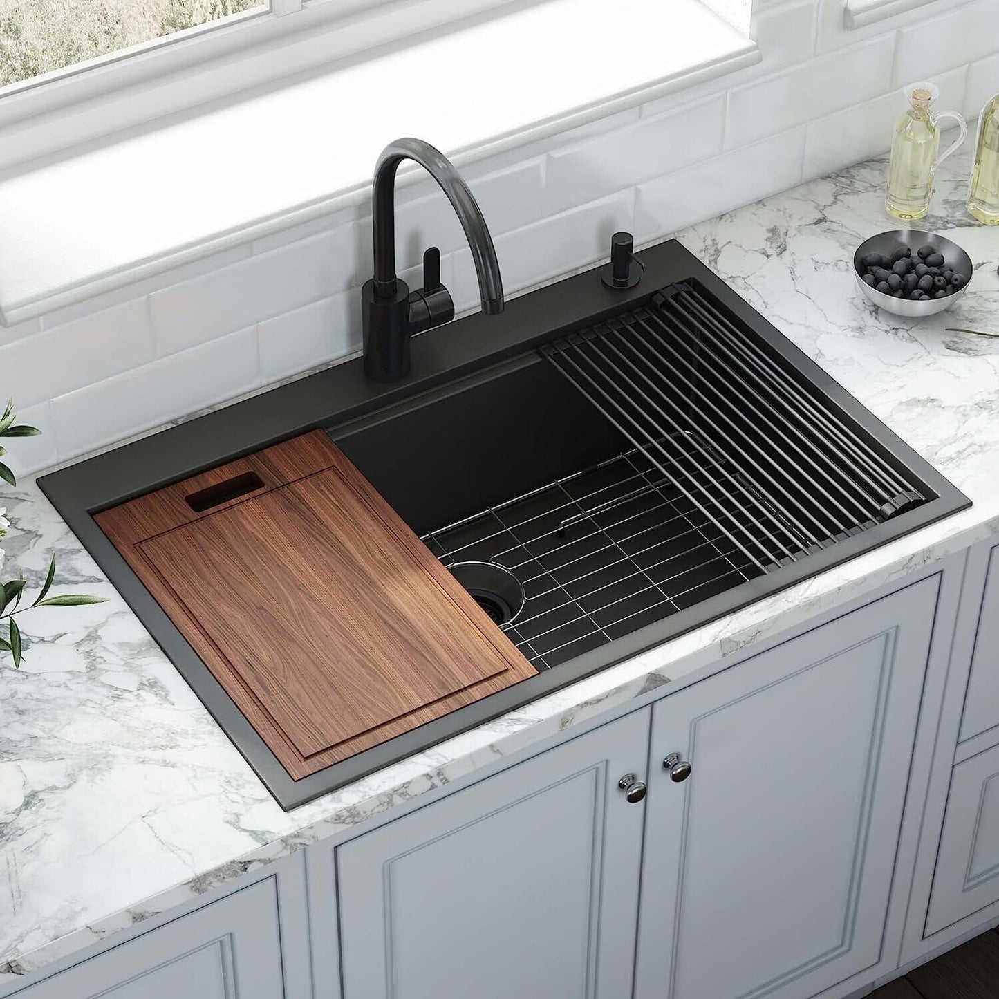 Black stainless steel kitchen sink with wooden cutting board and drying rack