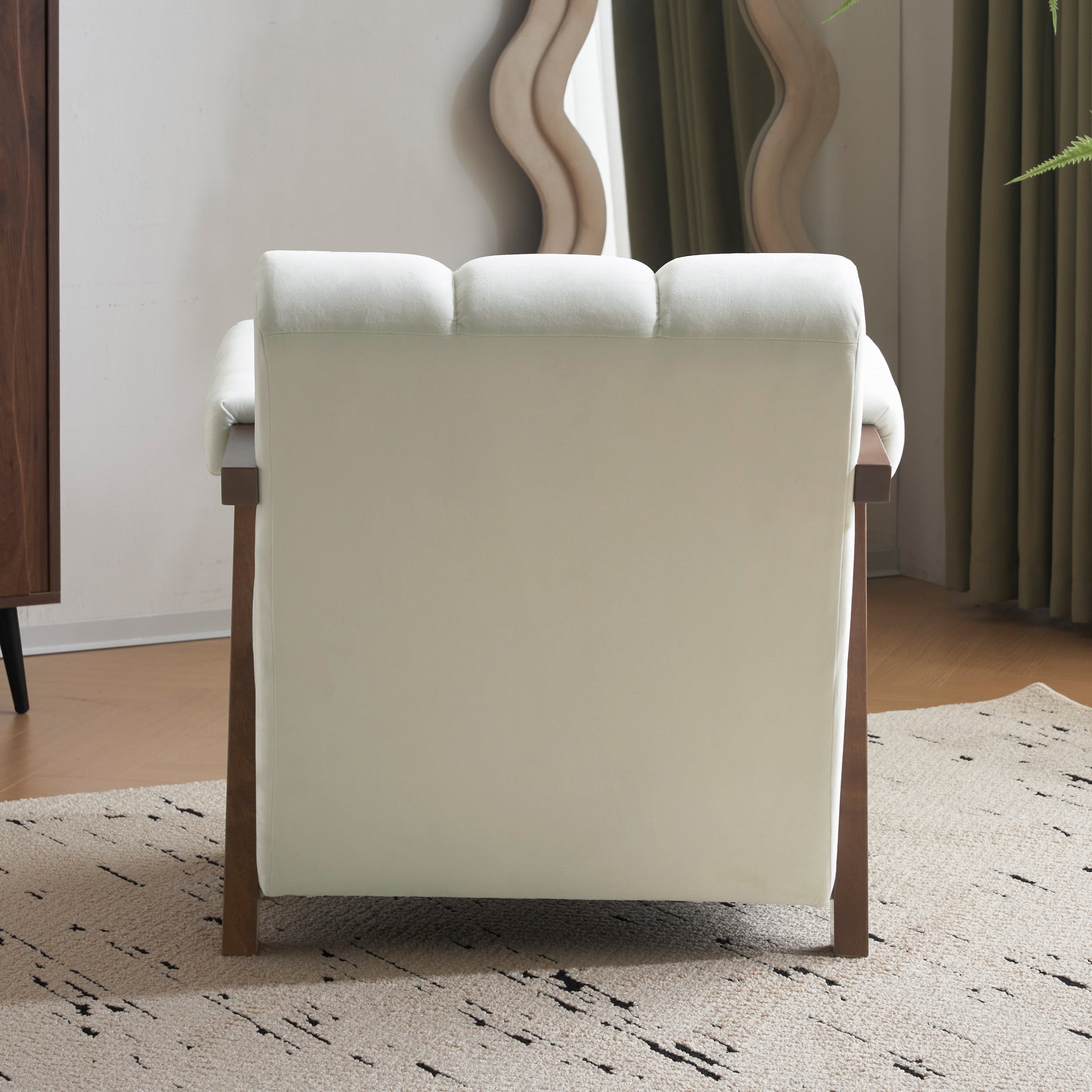 Cream upholstered accent chair with tufted backrest and dark wood frame