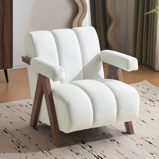 Plush white accent chair with channel tufting and dark wood legs perfect for a modern living room