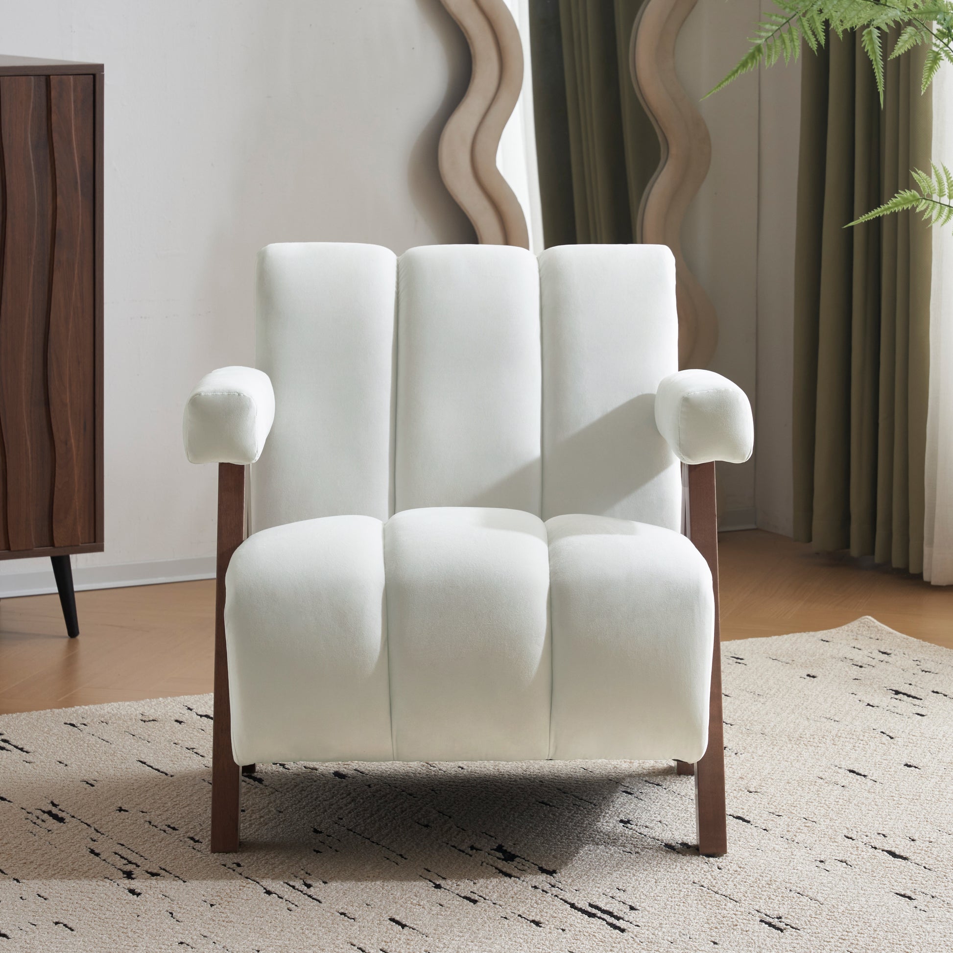 White velvet accent chair with channel tufting and wooden legs
