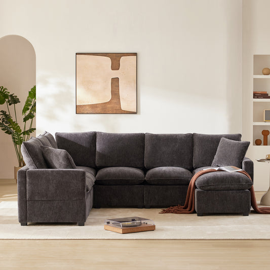 Deep charcoal sectional sofa with plush cushions and a chaise lounge perfect for modern living rooms