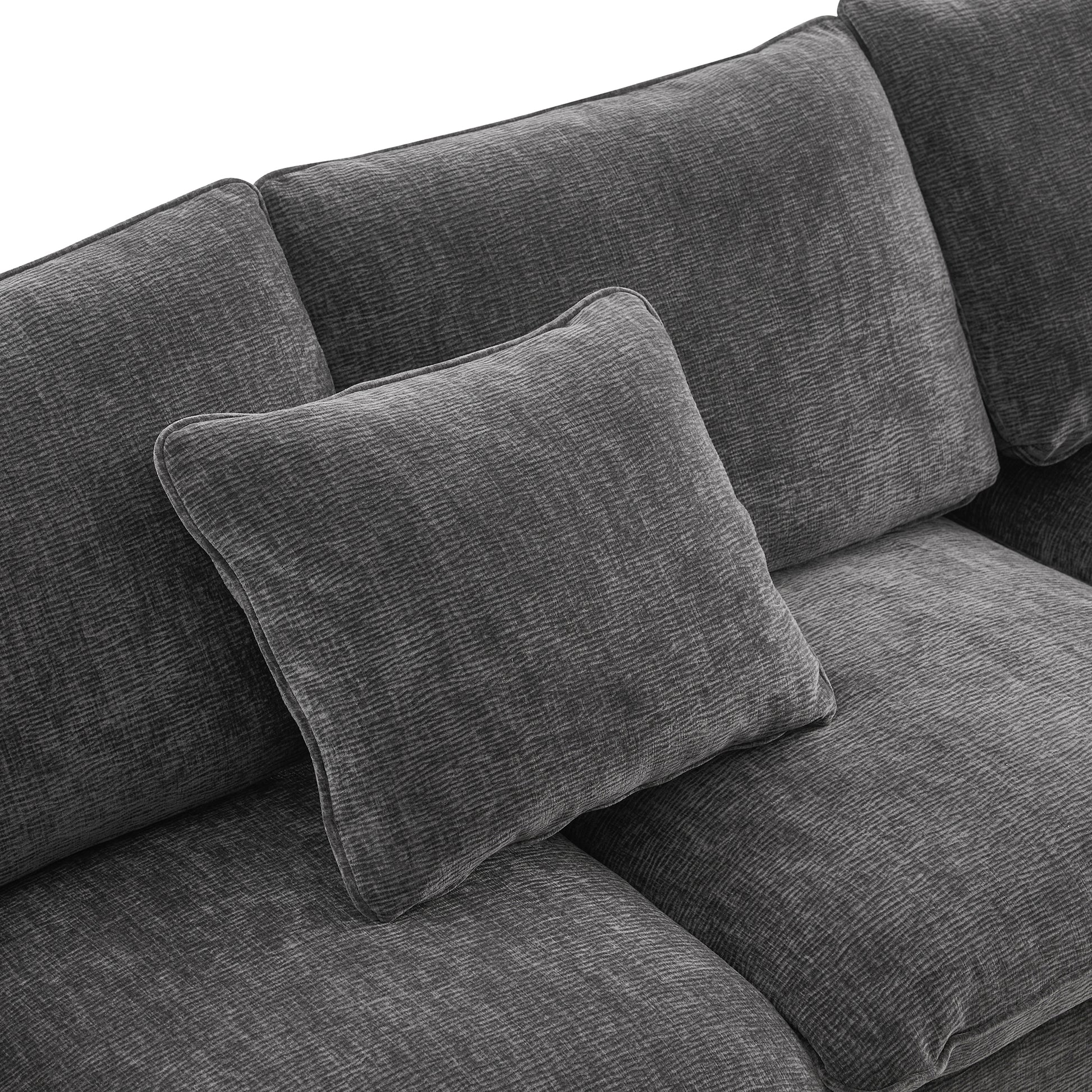 Charcoal grey textured fabric sofa cushion plush and inviting for living room comfort