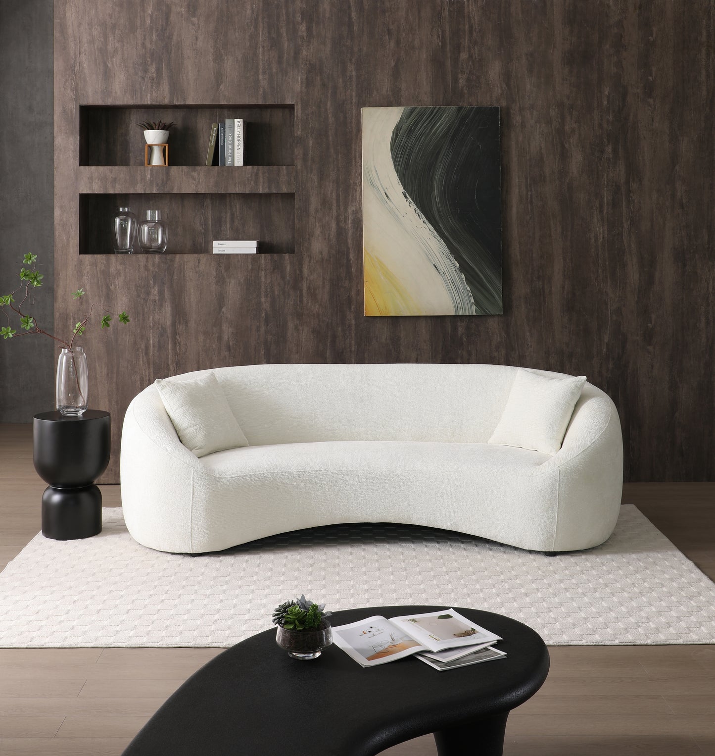 Curved white boucle sofa with plush cushions ideal for a modern living room seating arrangement