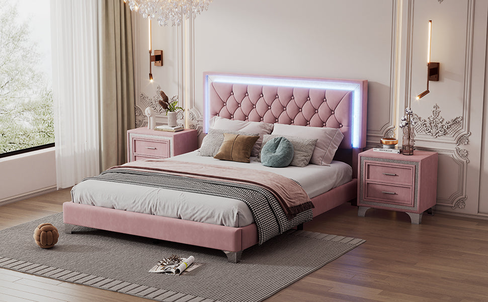Pink velvet tufted platform bed with LED headboard and ornate crystal chandelier overhead