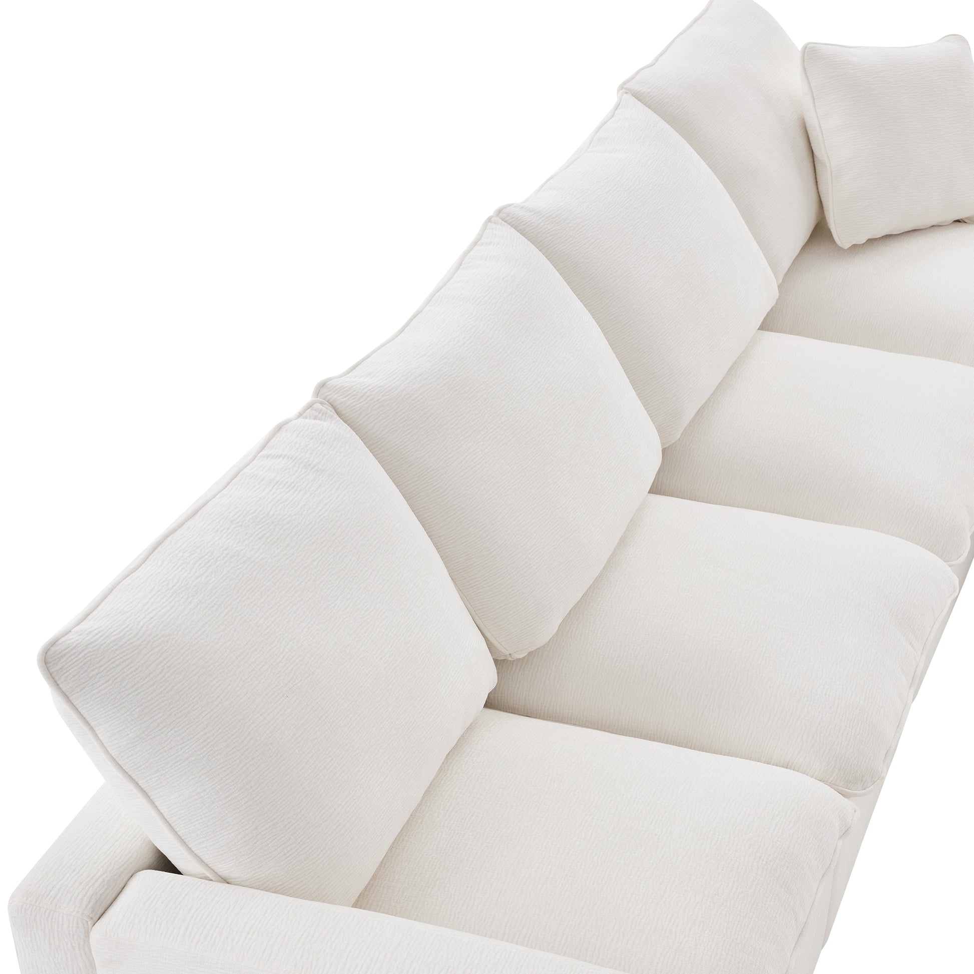 Plush white modular sectional sofa with deep textured cushions perfect for a contemporary living room