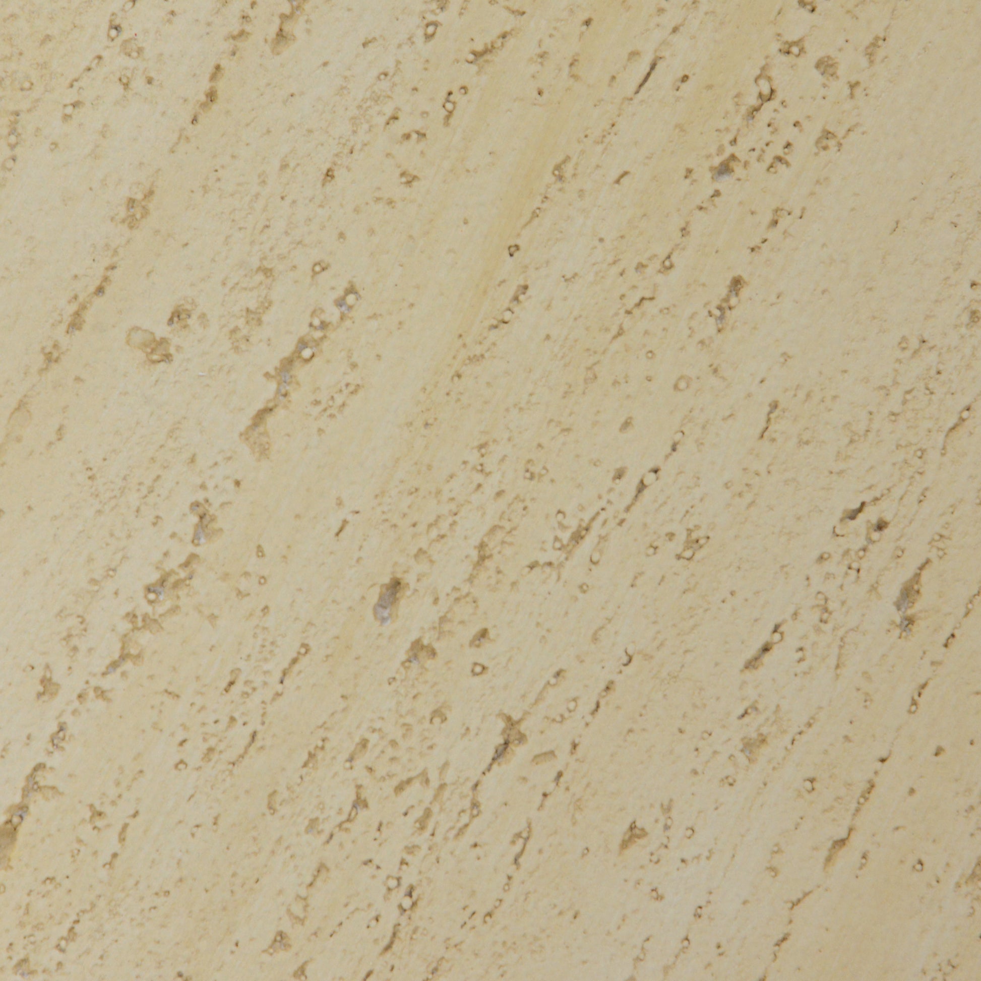 Textured beige travertine stone slab with natural variations