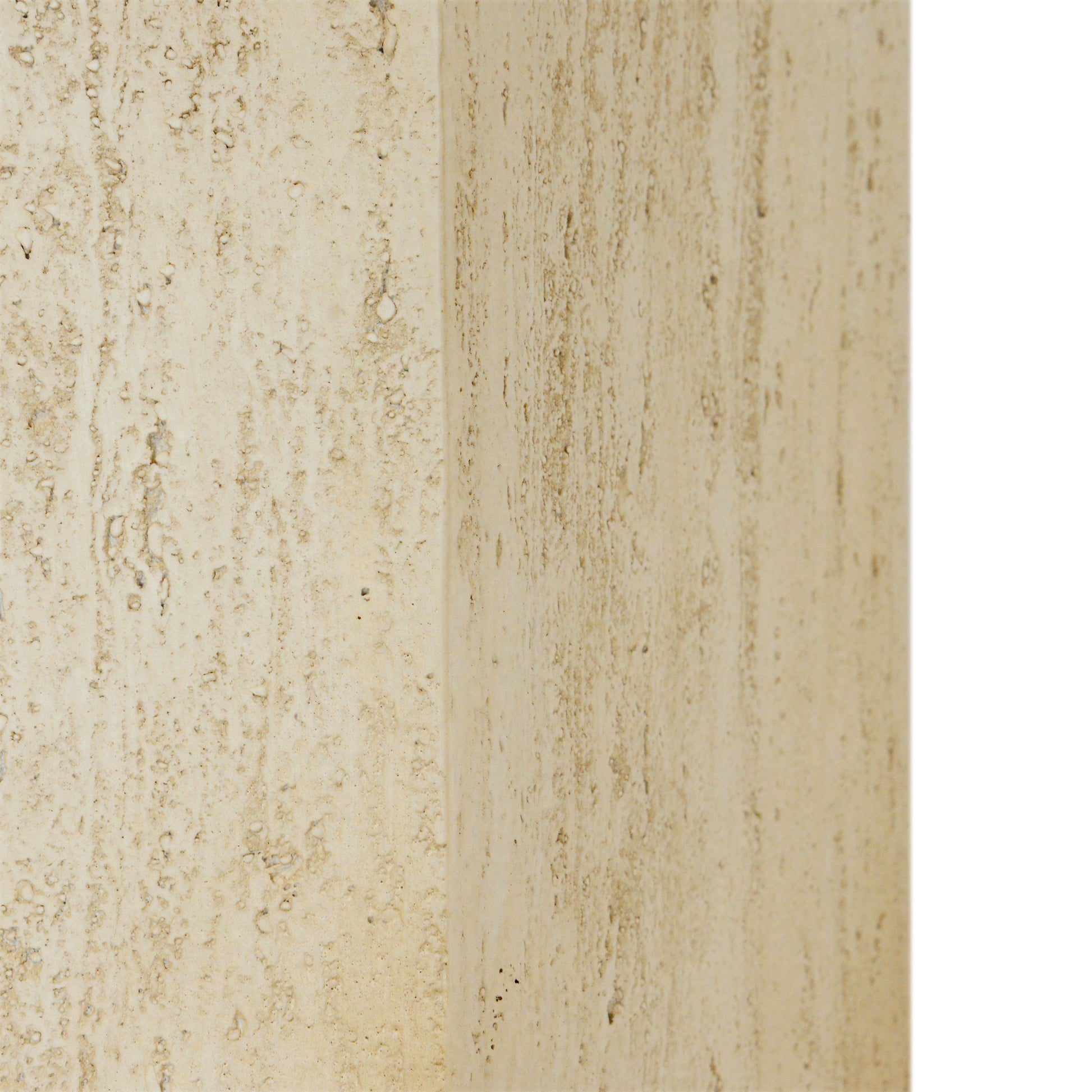 Closeup texture of beige travertine stone with natural pitting