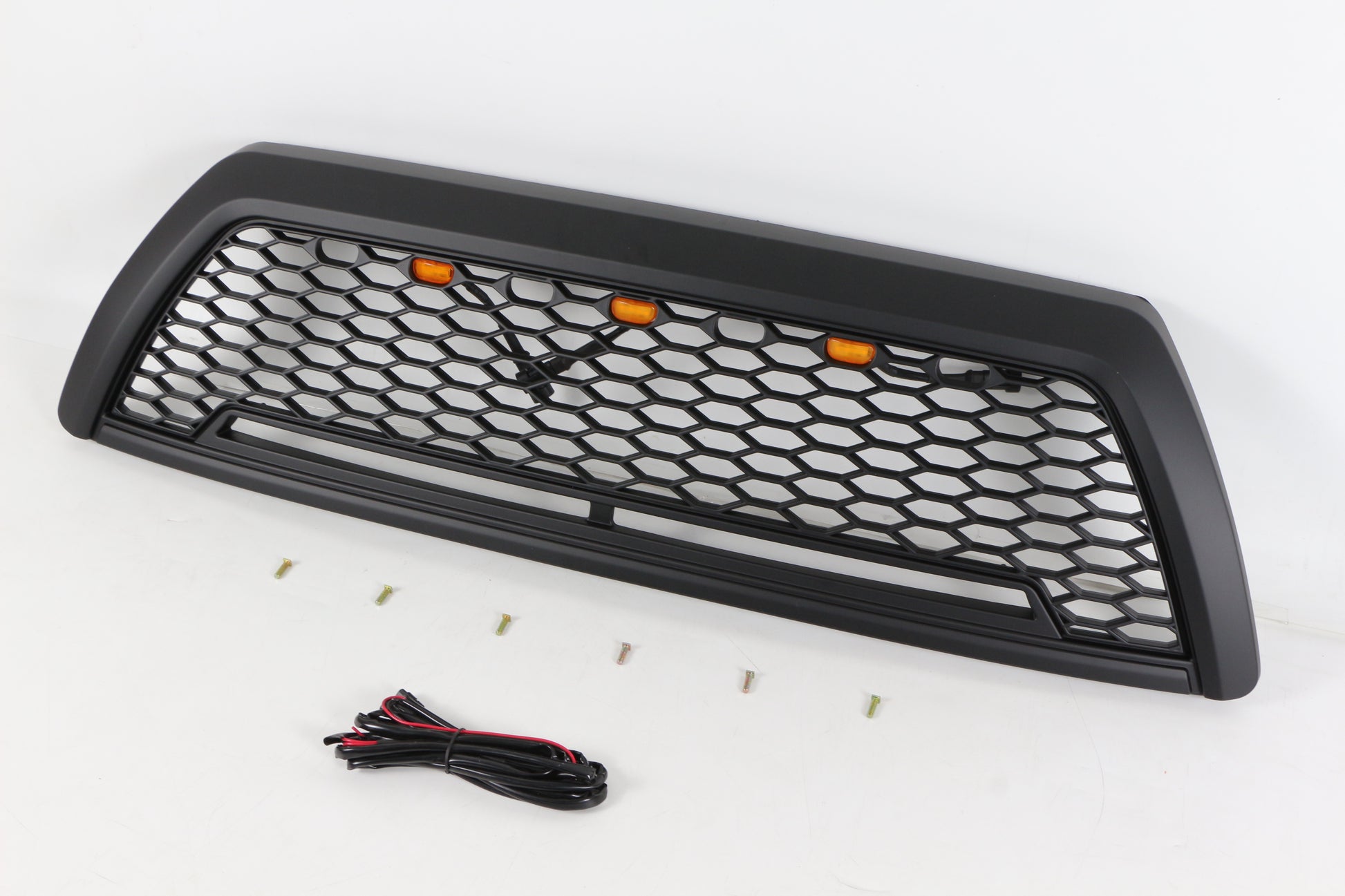 Black honeycomb raptor style grille with amber LED lights and hardware