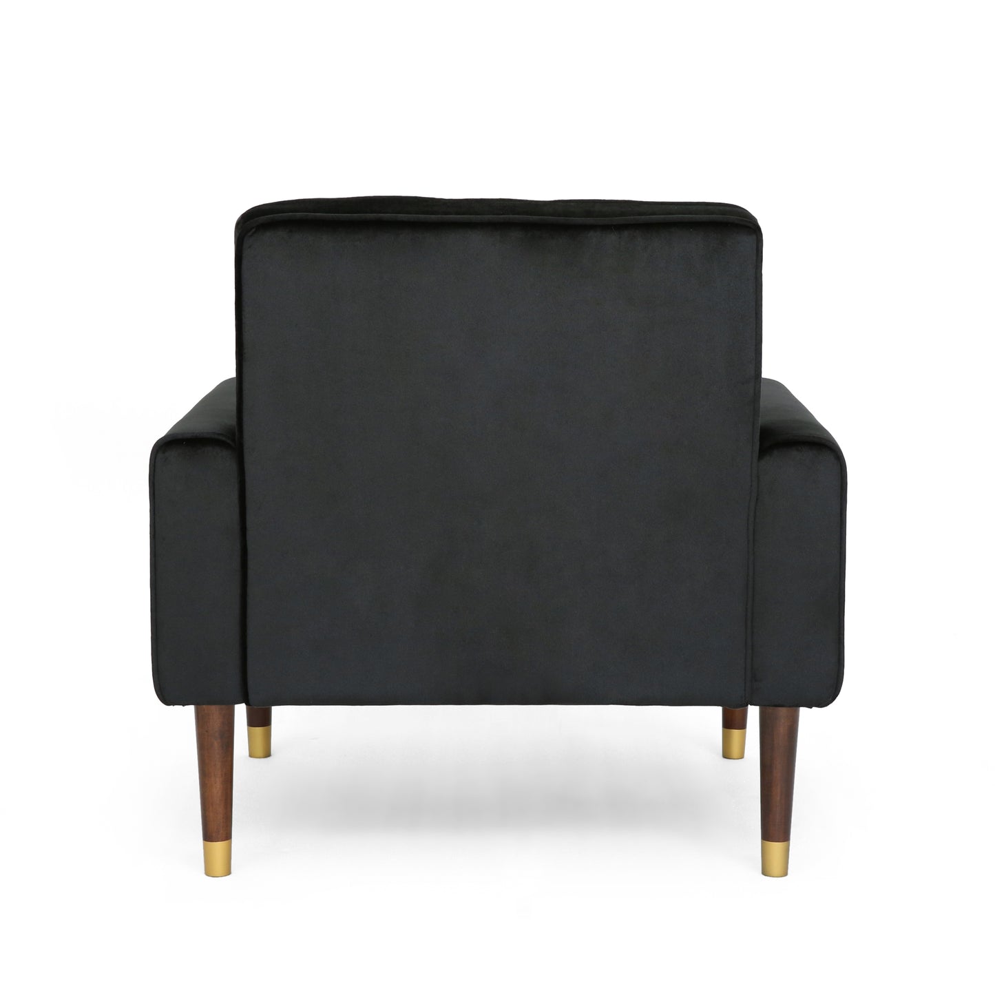 Back view of a plush black velvet armchair with dark wood legs and brass accents