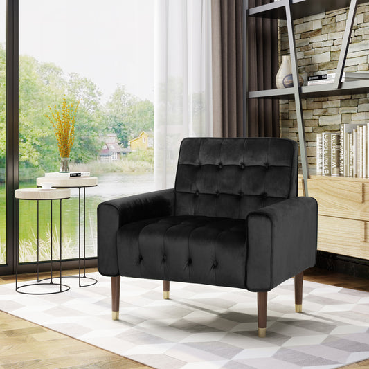 Black velvet accent chair with tufted back and goldtipped wooden legs