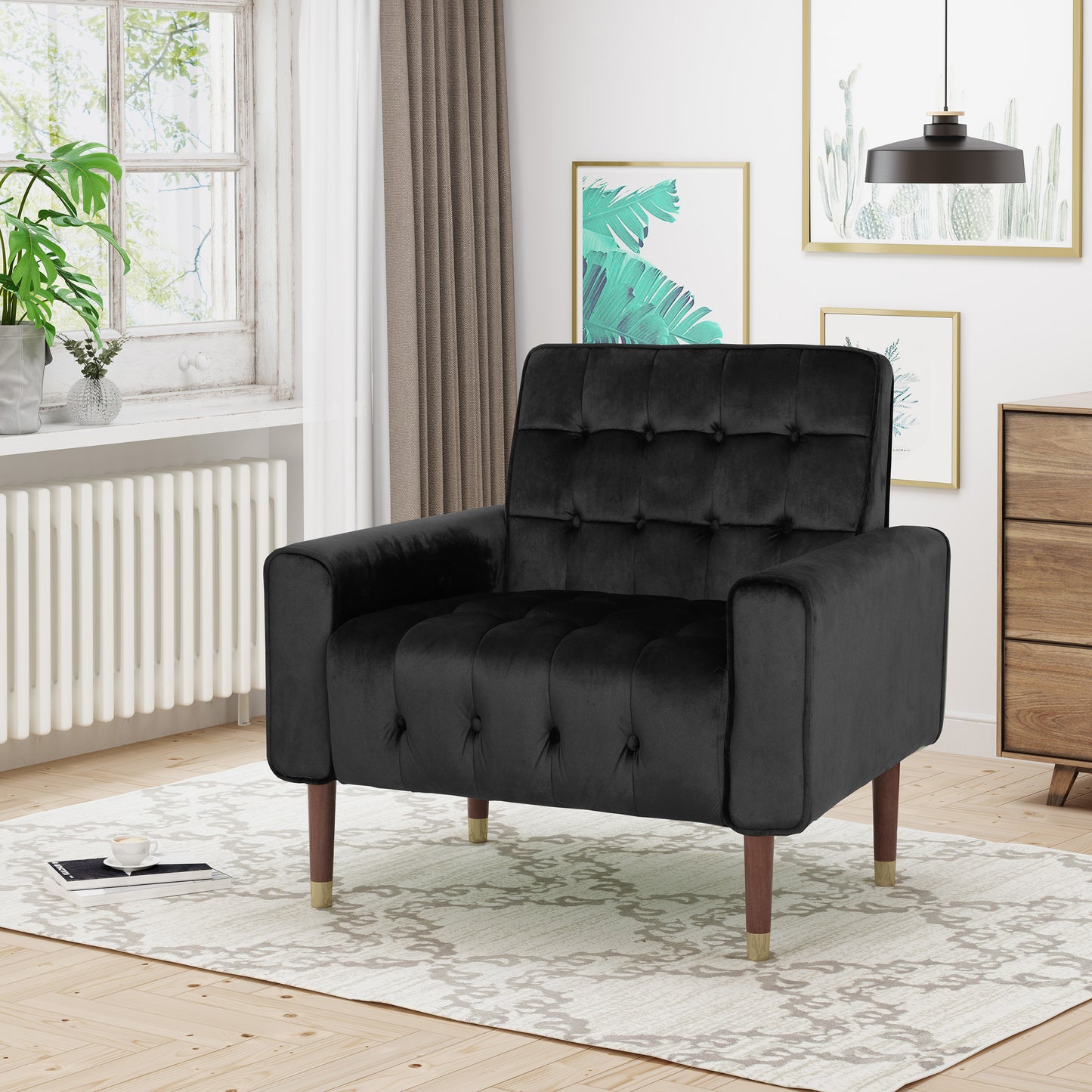 Black velvet accent chair with tufted back and tapered wooden legs