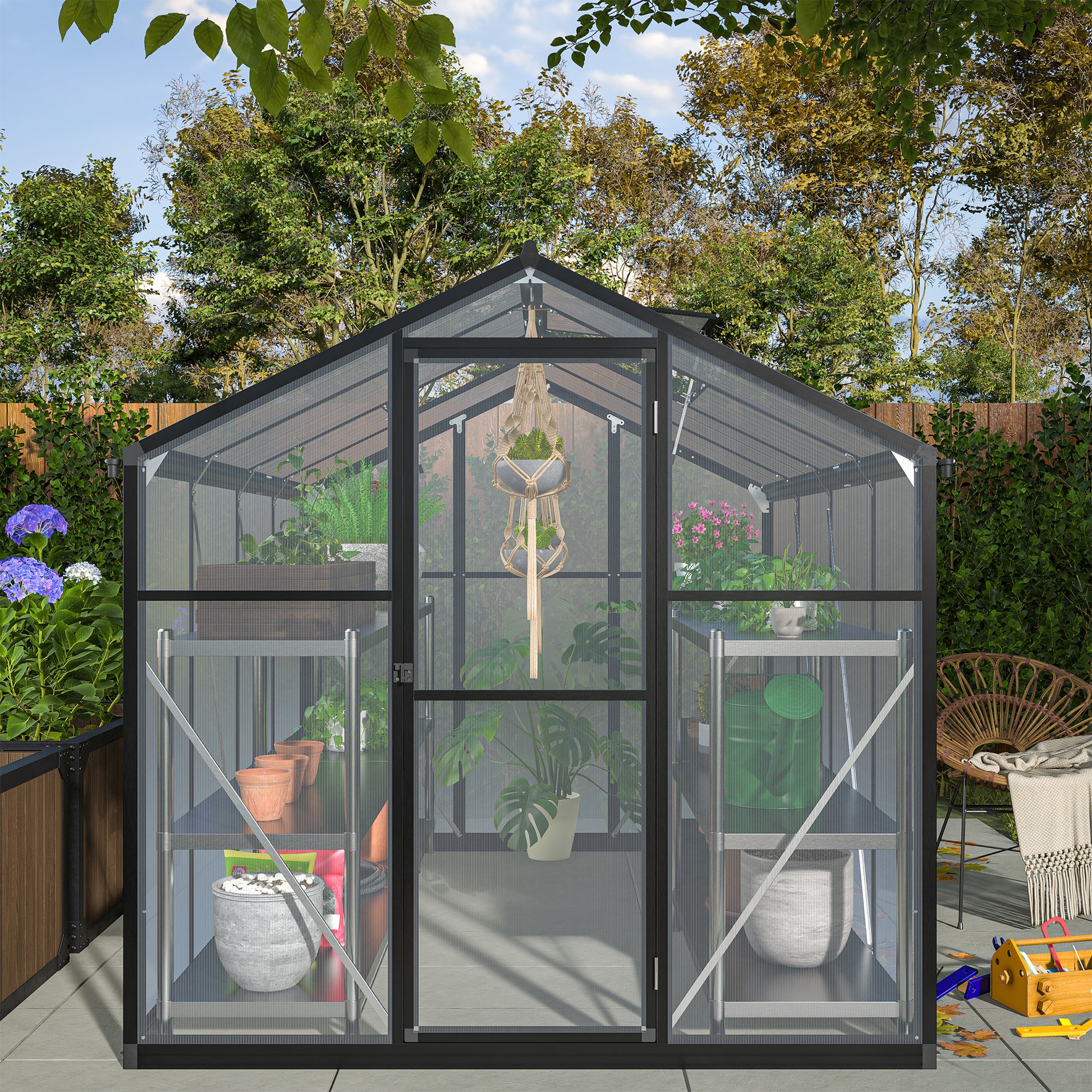Black aluminum frame greenhouse with clear polycarbonate panels and internal shelving perfect for gardening