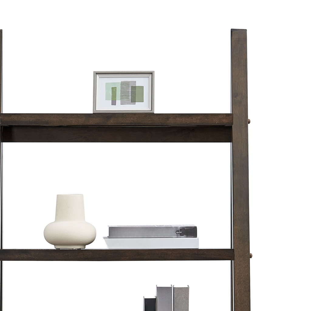 Dark wood ladder shelf with modern art and cream vase
