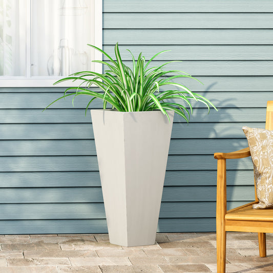 Tall white tapered planter with striped spider plant perfect for patio decor