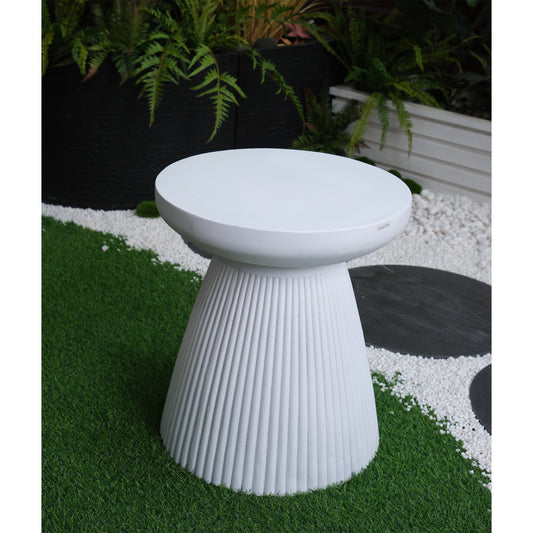 Modern white fluted outdoor side table on artificial grass