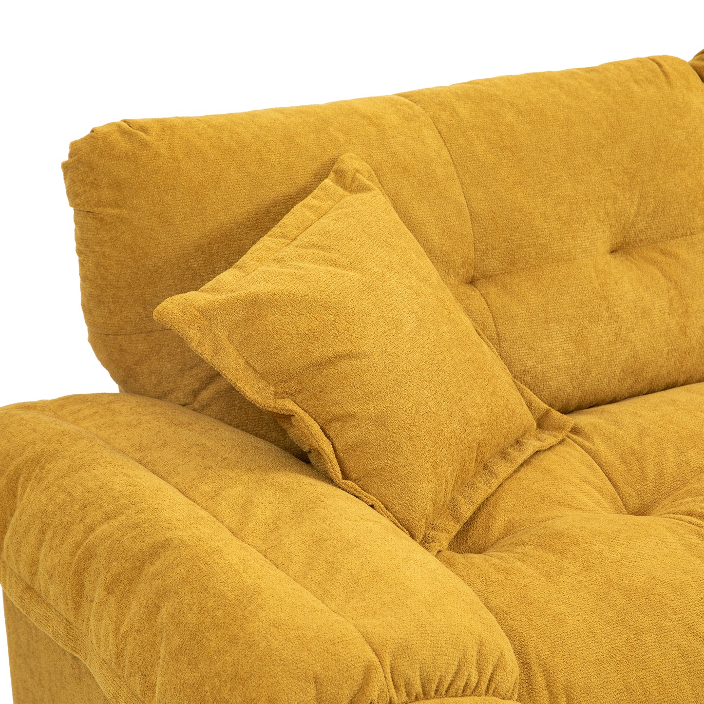 Closeup of a tufted mustard yellow fabric sofa with a matching throw pillow perfect for living room comfort