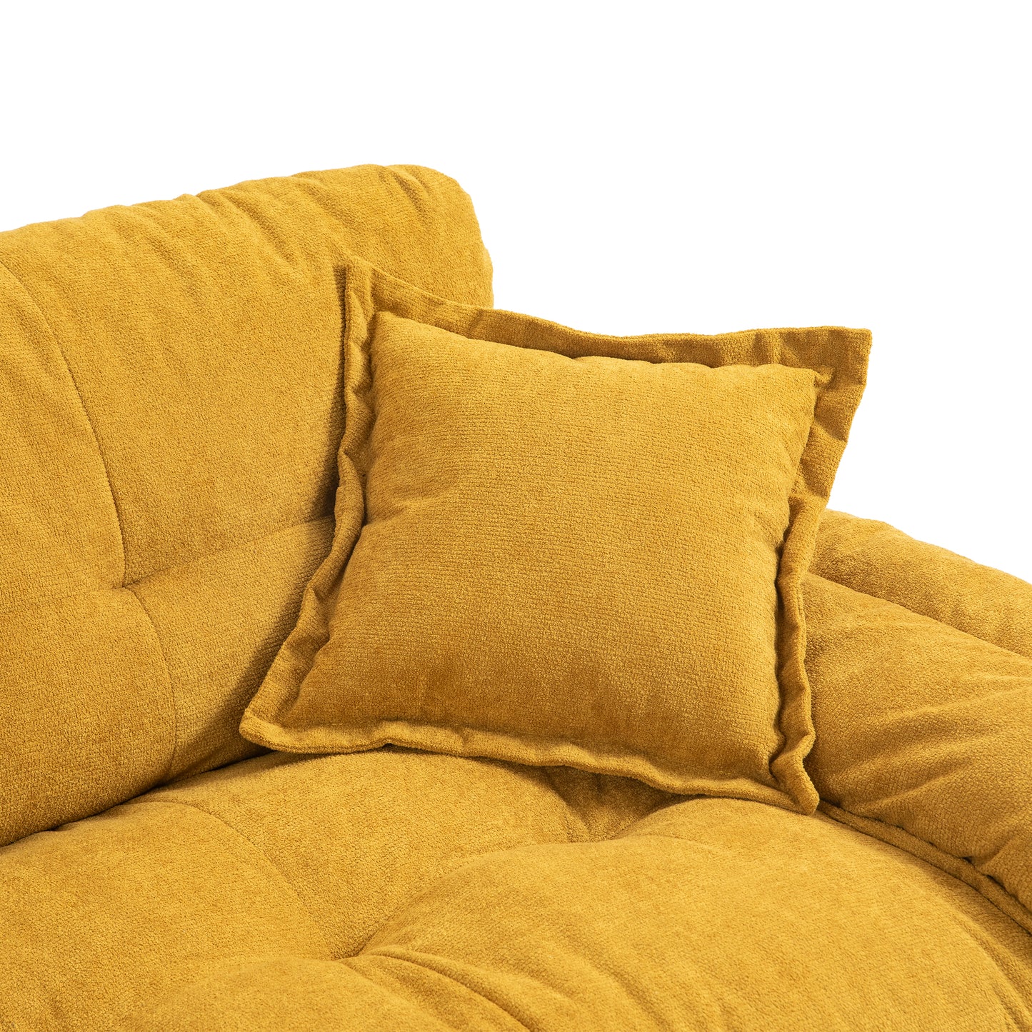 Mustard yellow textured throw pillow on a tufted sofa adding comfort and style to living spaces