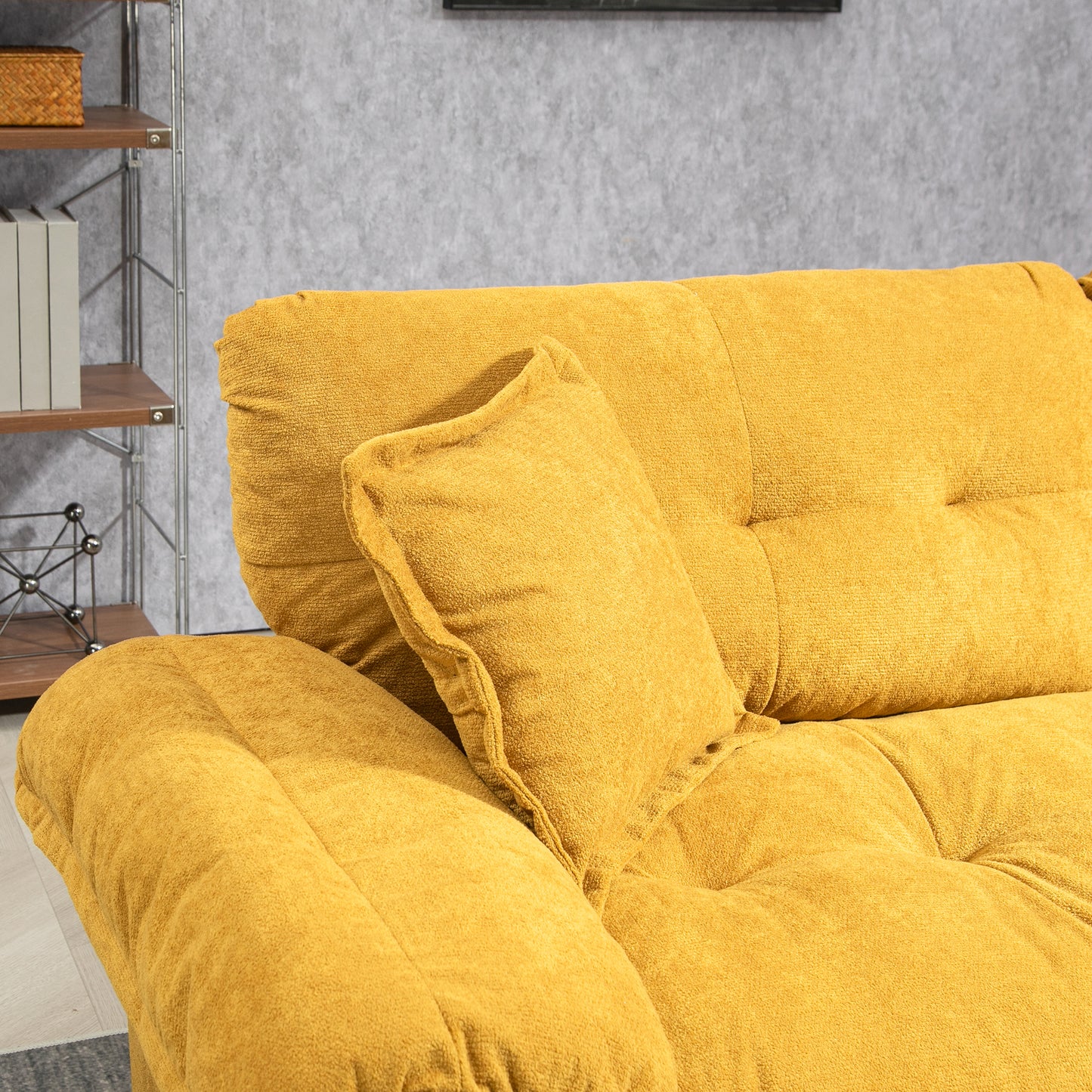 Closeup of a plush yellow sofa with tufted cushions and a textured fabric