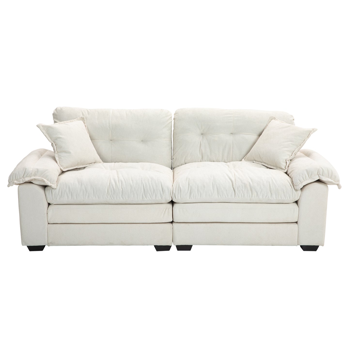 Plush ivory fabric sofa with tufted cushions and two accent pillows perfect for modern living rooms