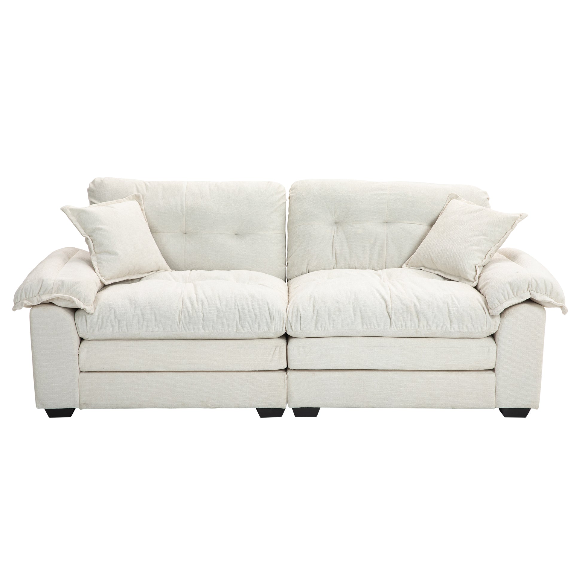 Plush ivory fabric sofa with tufted cushions and two accent pillows perfect for modern living rooms