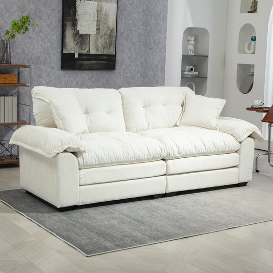 Plush cream sofa with tufted cushions perfect for modern living rooms