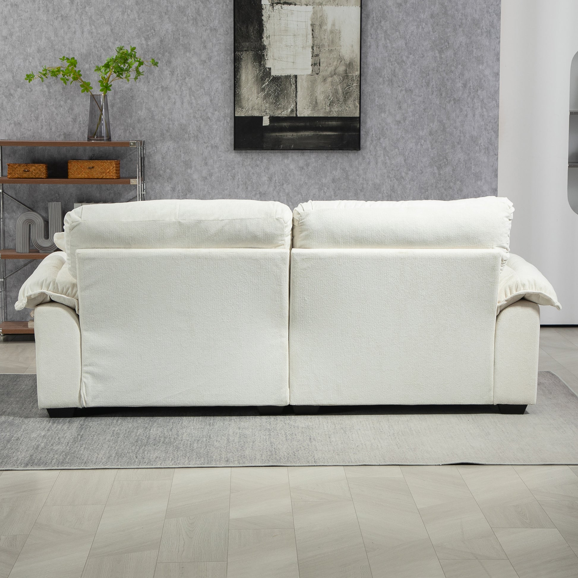 Modern white fabric sectional sofa with plush back cushions and clean lines