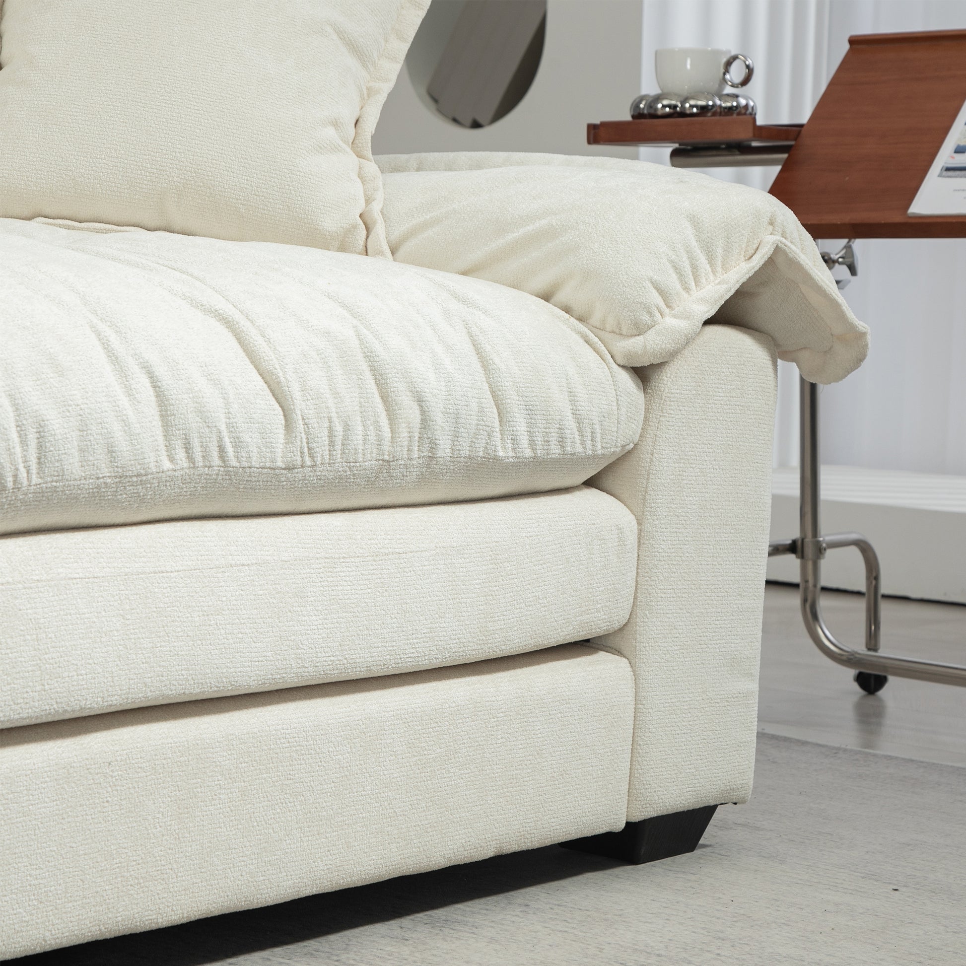 Cream boucle sofa with plush cushions perfect for a cozy living room setup