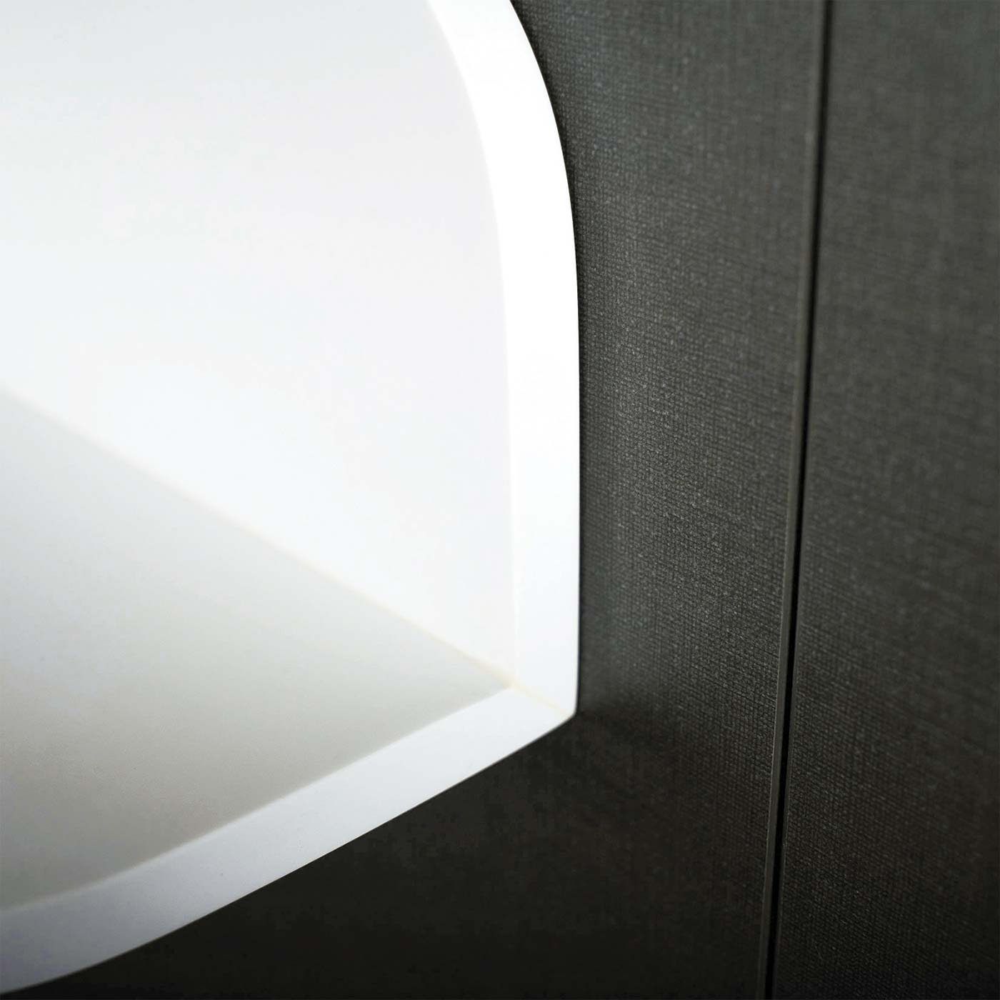Abstract white curved surface meets dark textured panel modern home decor accent