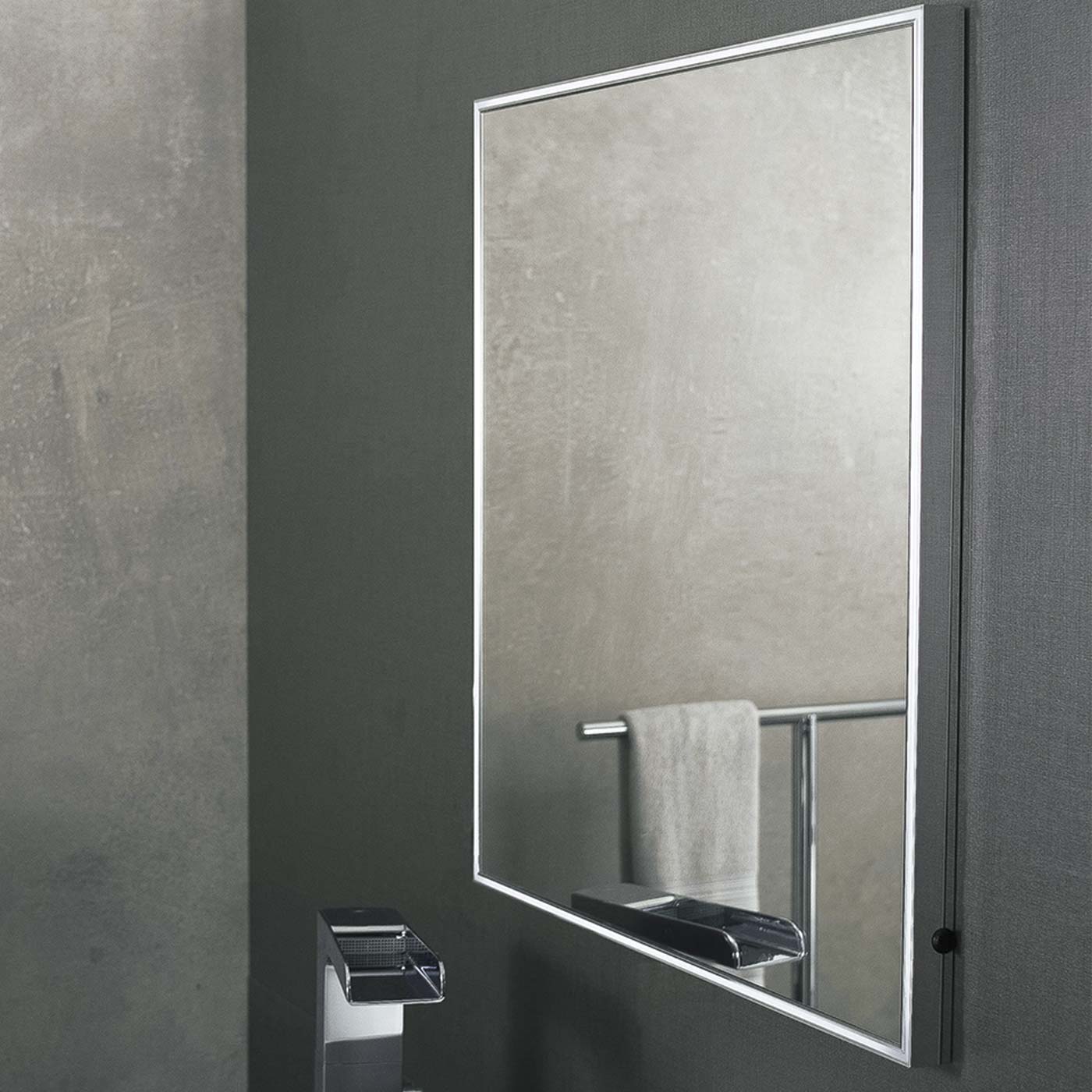 Modern rectangular bathroom mirror with a sleek silver frame and integrated shelf
