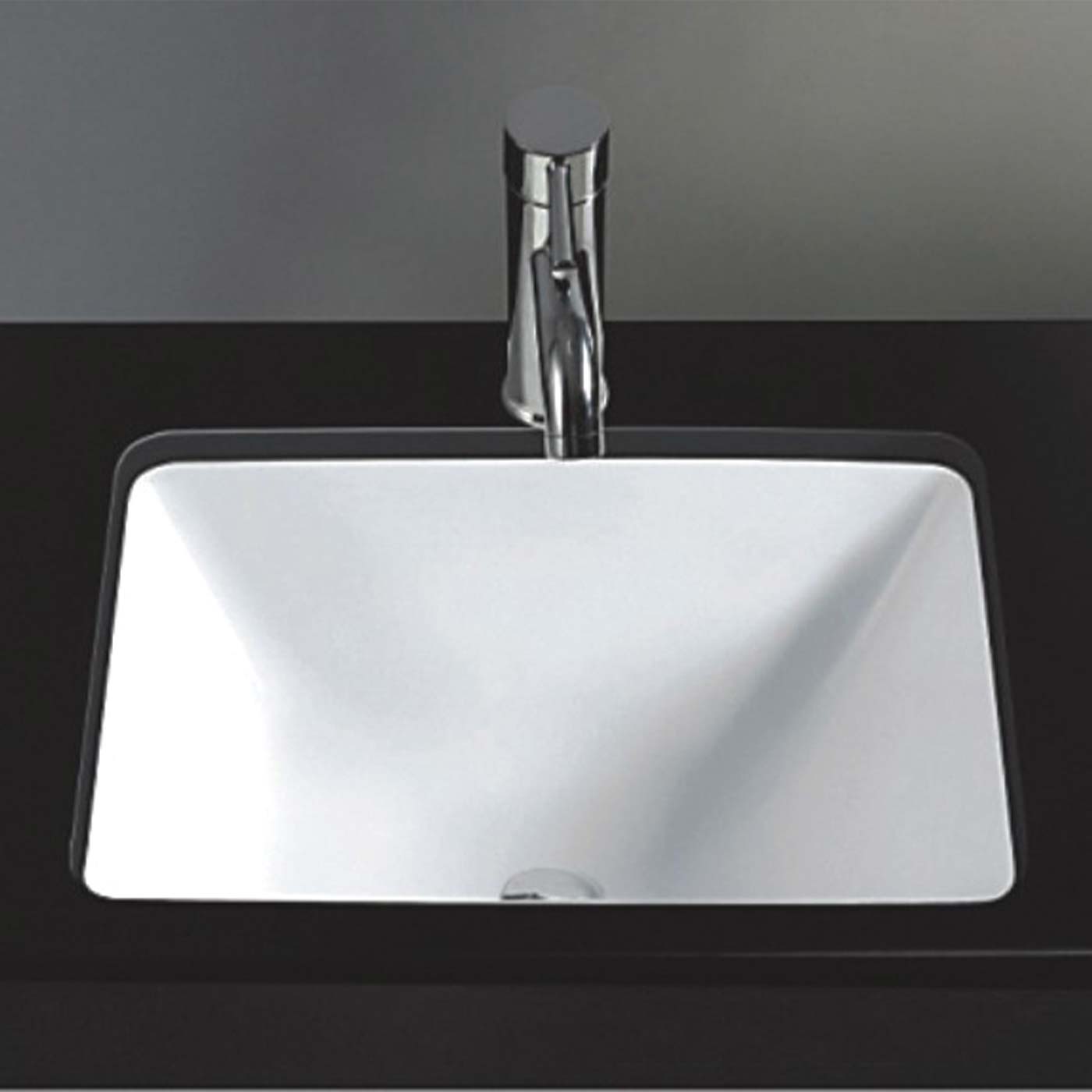 White rectangular ceramic bathroom sink with chrome faucet