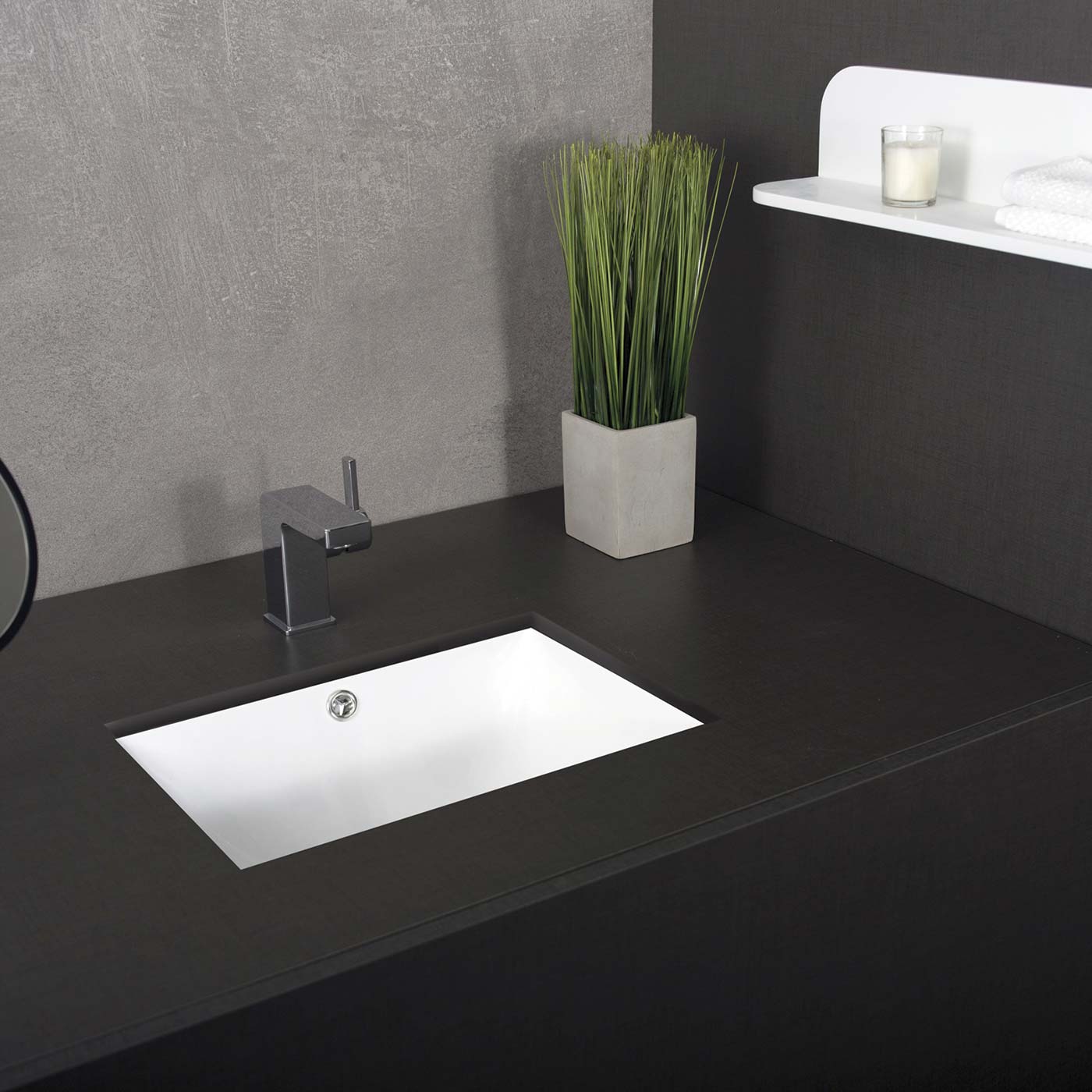 Modern white ceramic vessel sink with chrome faucet on dark wood vanity