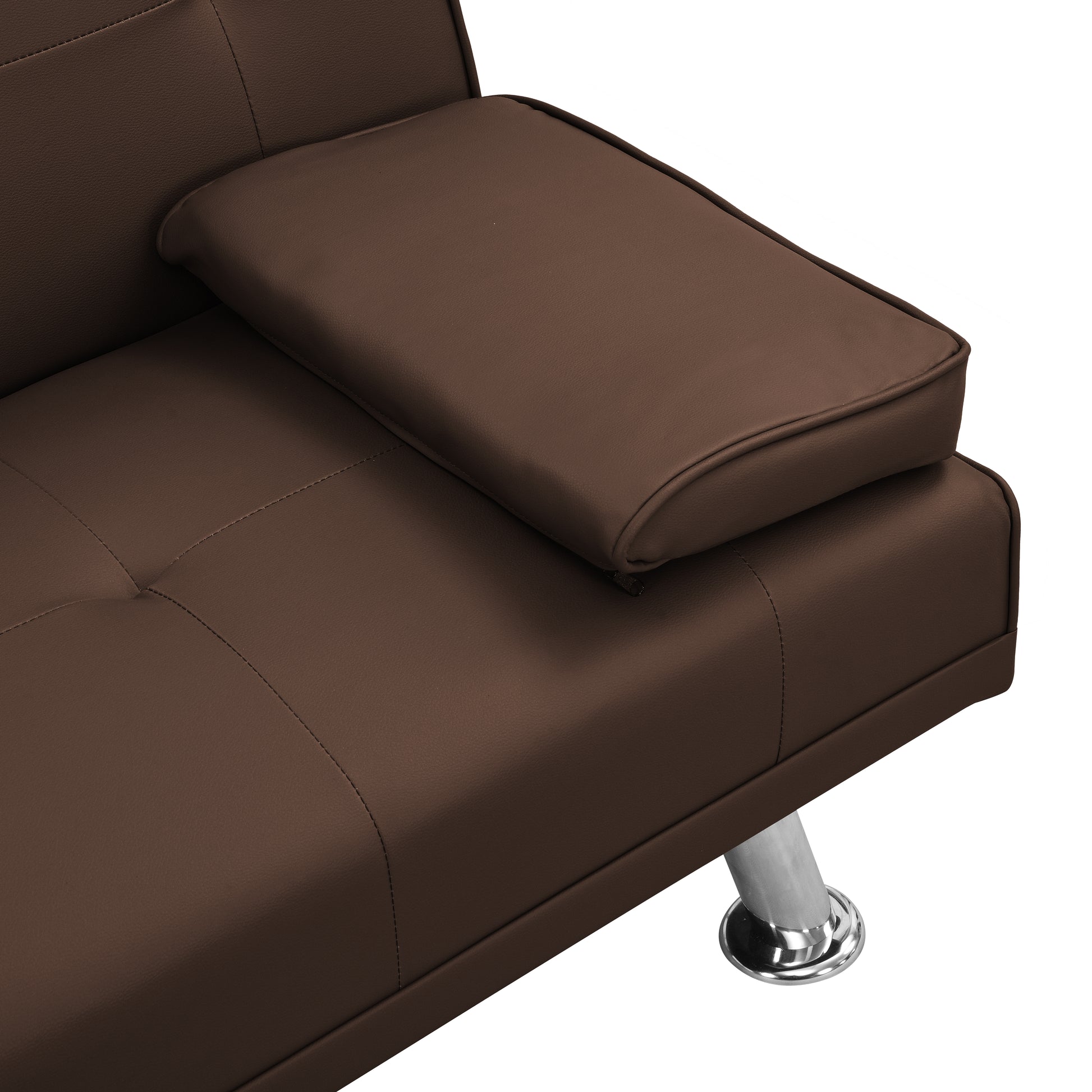 Closeup of brown faux leather sofa armrest with tufted seat detail and chrome leg